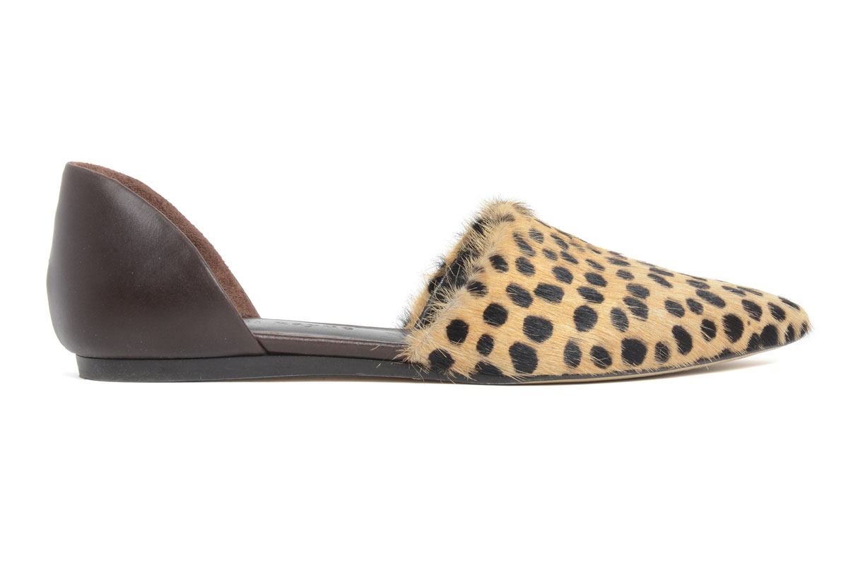 A flat women’s shoe with a pointed toe, featuring a leopard print front made of faux fur and a solid dark brown heel. The inner lining appears to be a light brown material.