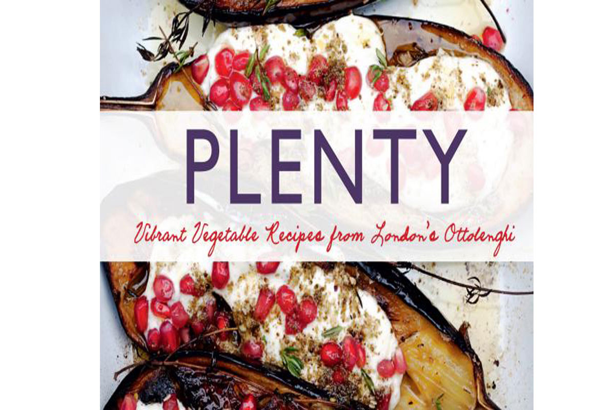 The cover of the cookbook Plenty features roasted eggplants topped with yogurt, pomegranate seeds, and herbs. The title PLENTY is in bold letters, with the subtitle Vibrant Vegetable Recipes from Londons Ottolenghi.