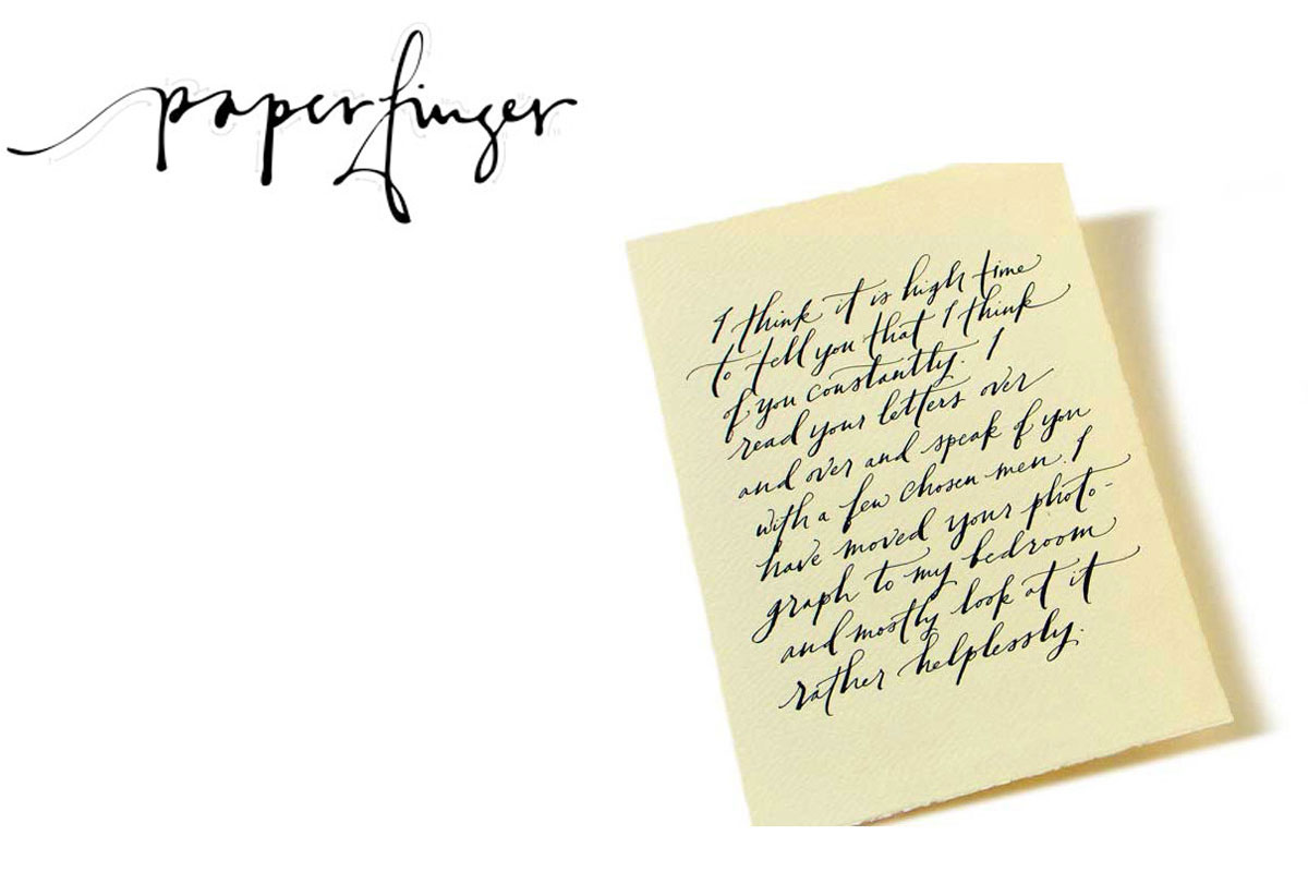 A cream-colored paper with elegant, slanted black calligraphy script sits on a white background. “Paperfinger” is written artistically in cursive in the top left corner.