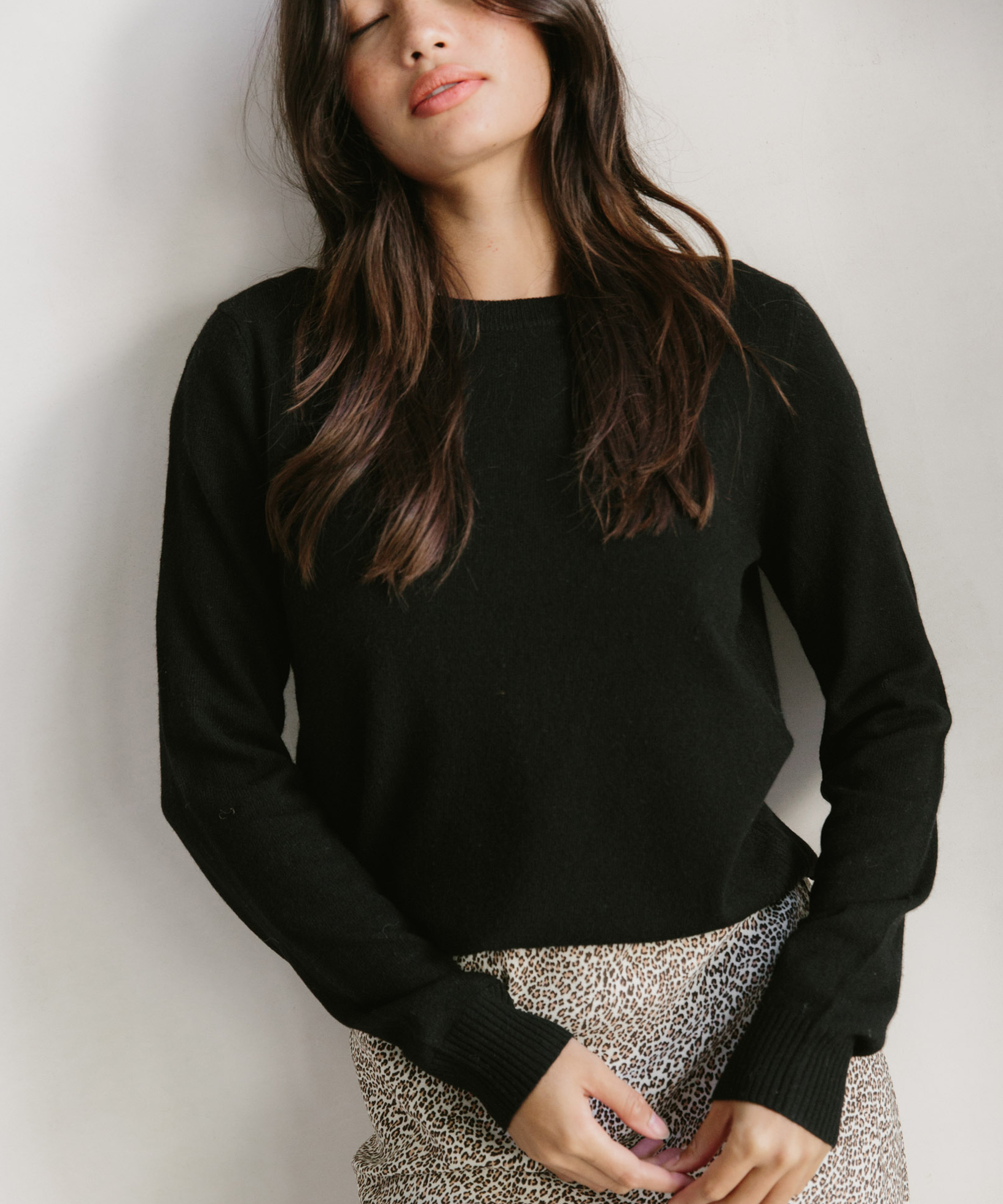 Jenni Kayne model wearing black Everyday Sweater and Leopard Slip Skirt.