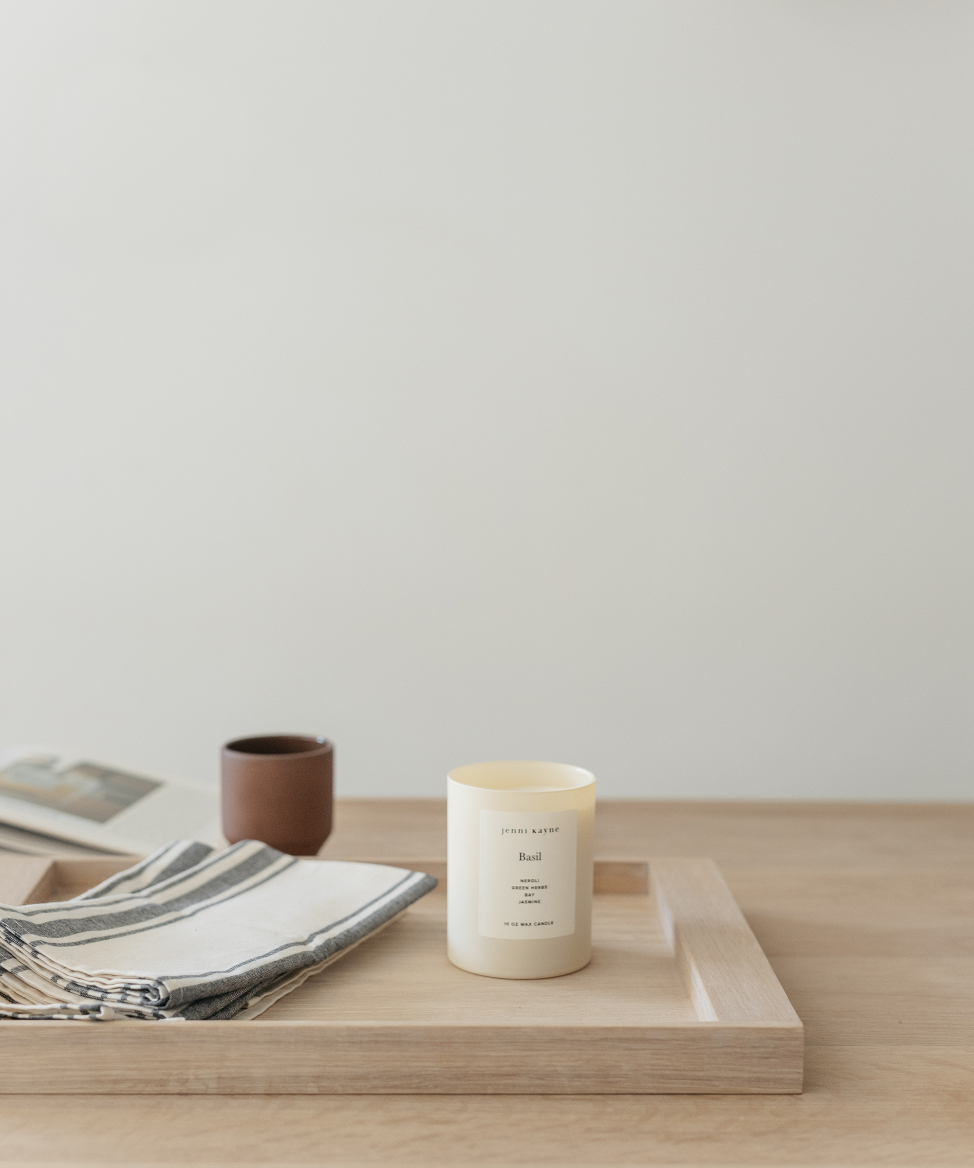 Alison Mazurek's Vancouver kitchen table with a jenni kayne basil candle and hand towels.