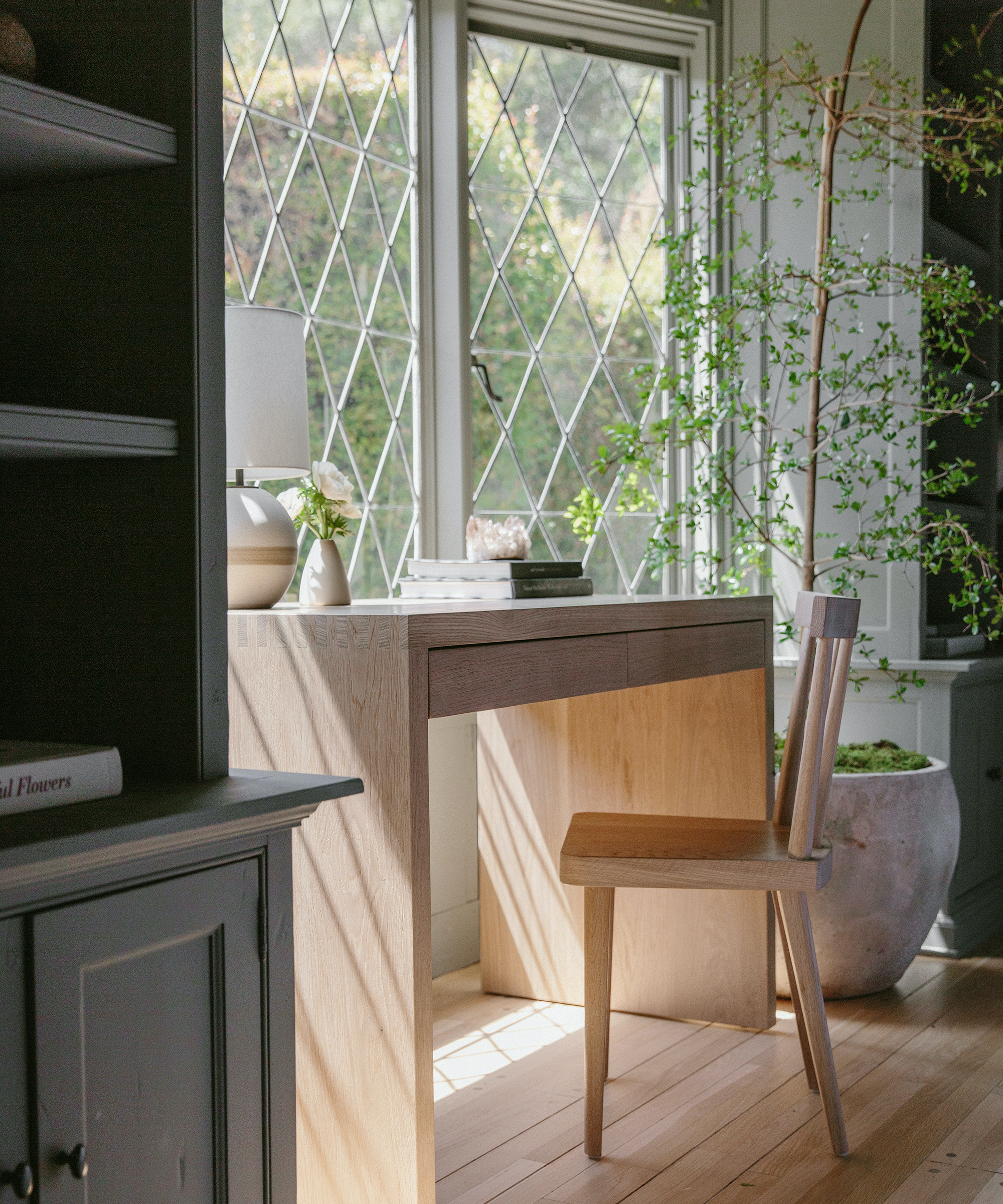An after shot of A before shot of Julia Hunter's Mandeville Canyon den with Newport Desk and Hampton Chair.