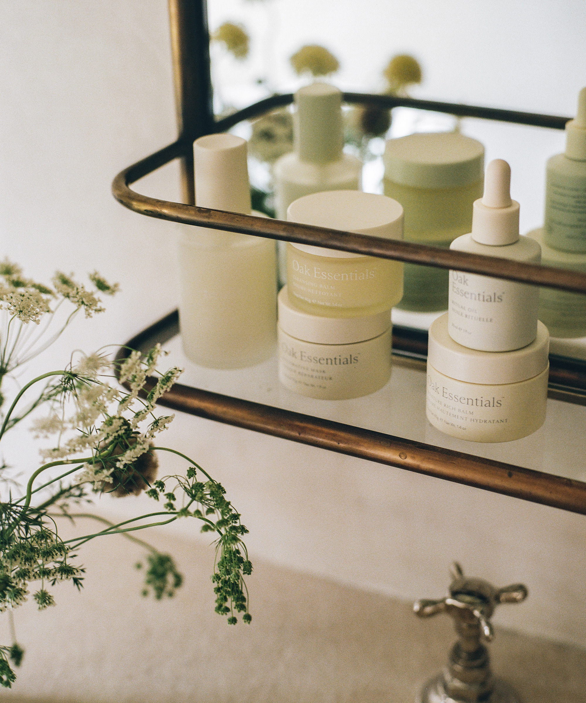 Oak essentials products sitting on jenni's bathroom vanity.