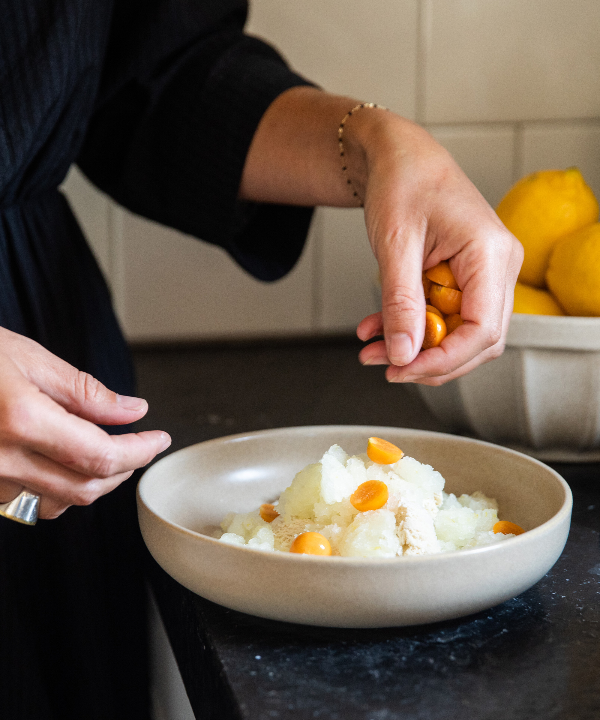 Olivia Muniak plating a summer dessert in her kitchen.