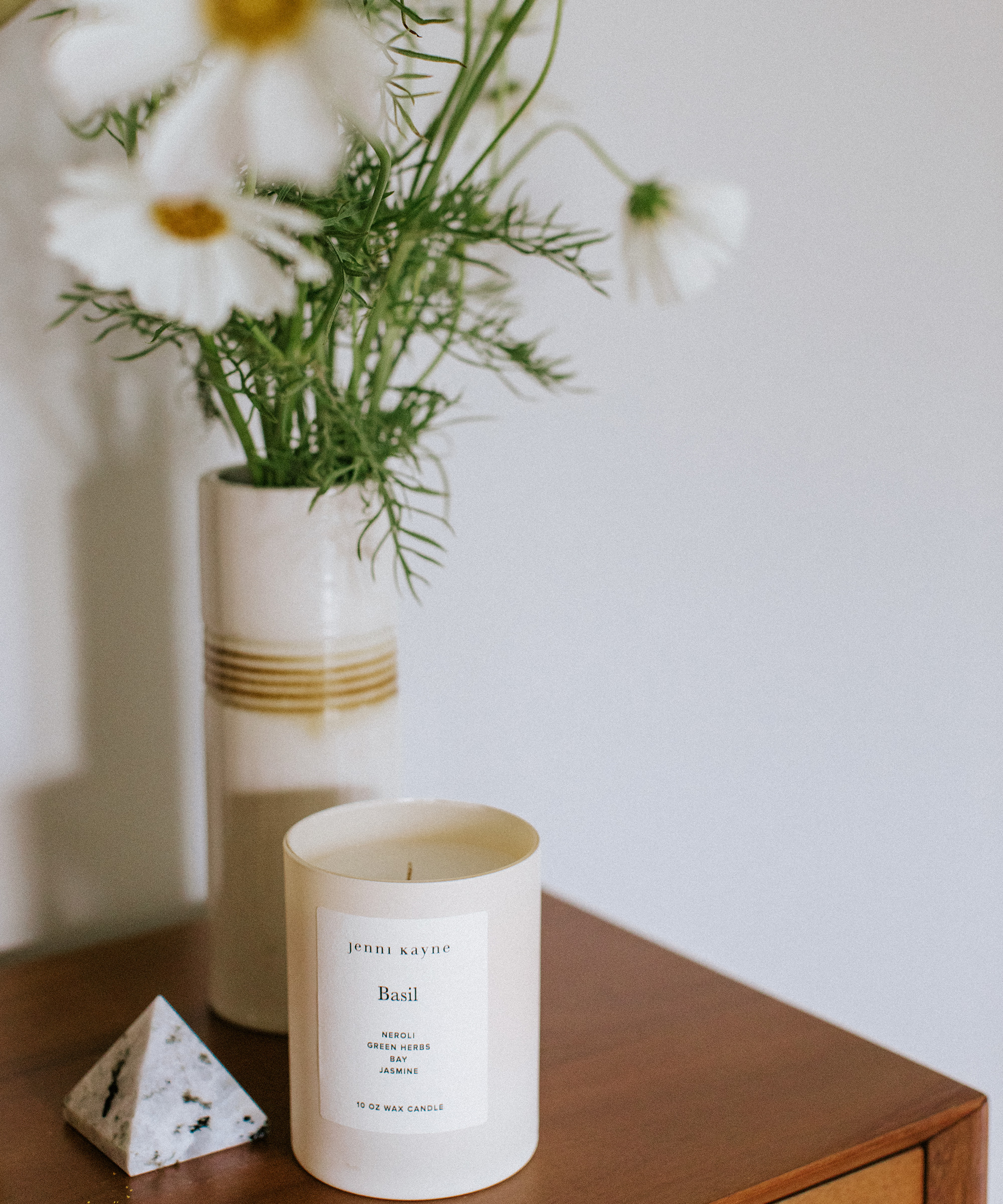 britta plug's desk with jenni kayne candle on top of it.