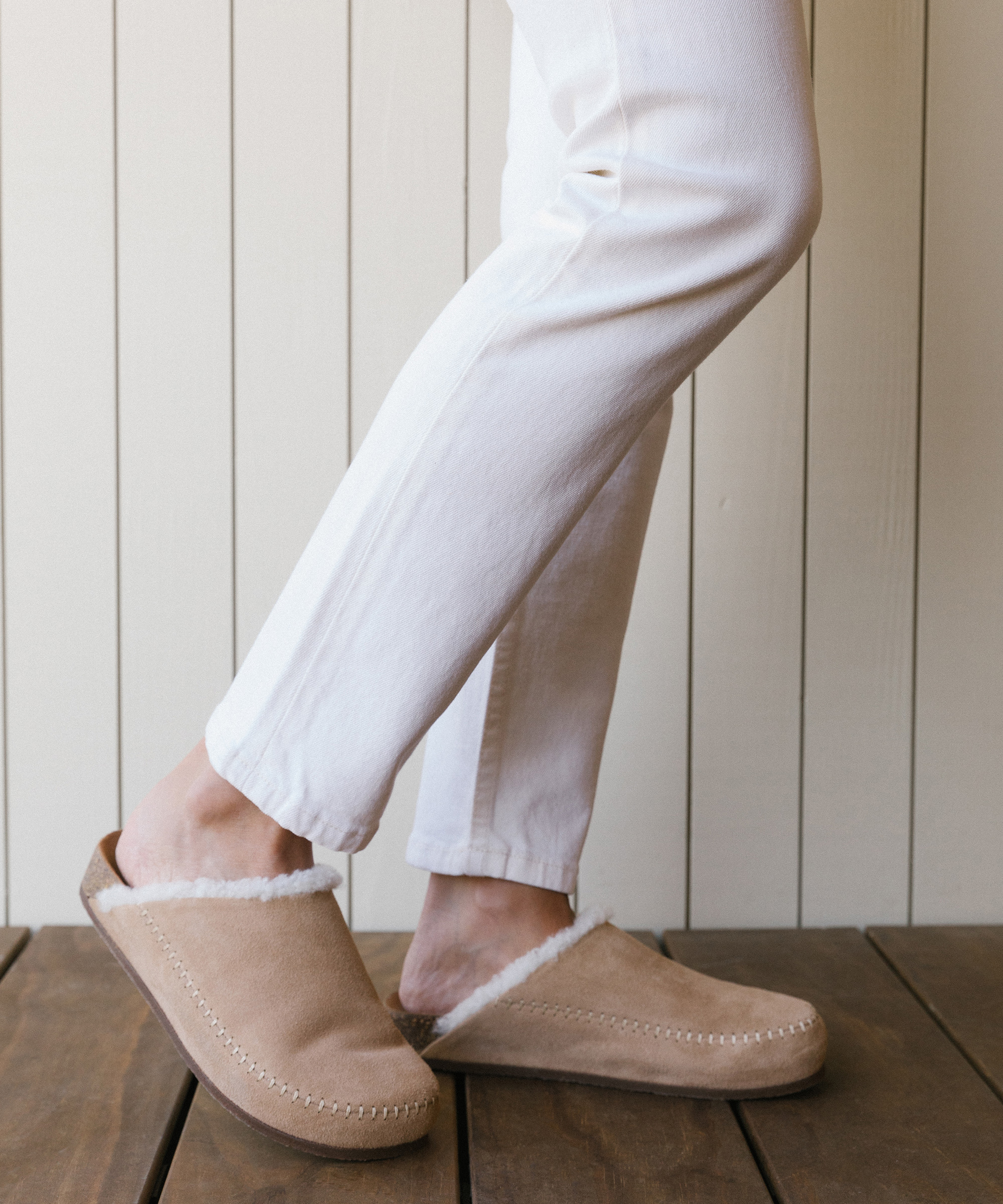model wearing plaid overshirt with white jeans and white tee and natural mocs.
