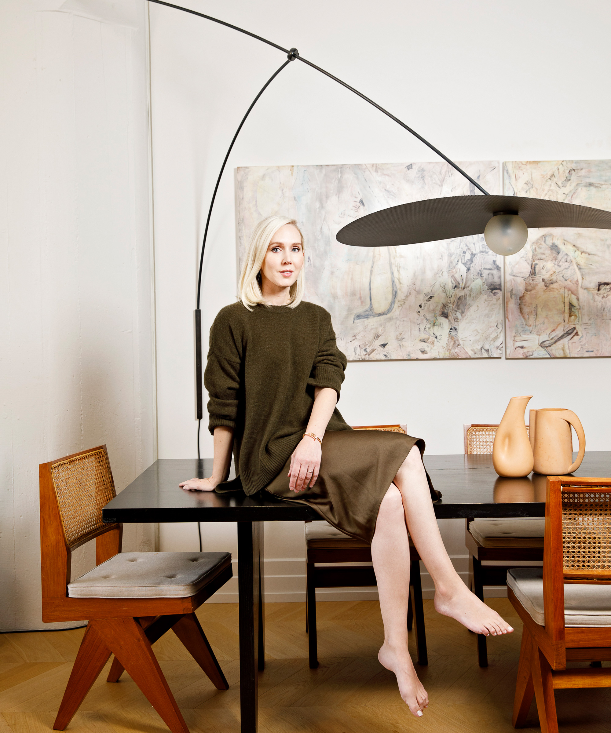 image of jane keltner de valle sitting on her dining room table