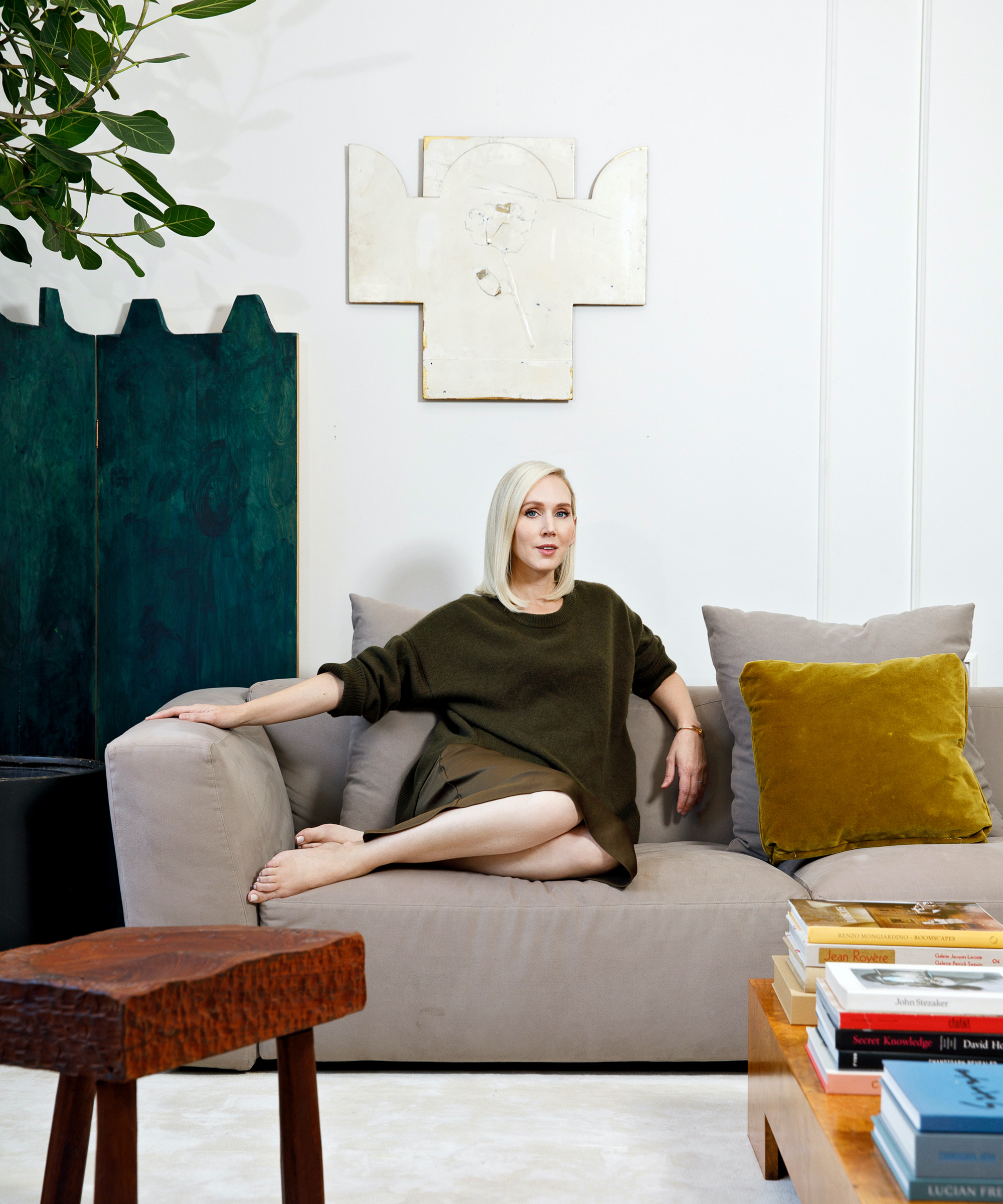 image of jane keltner de valle sitting on her living room sofa