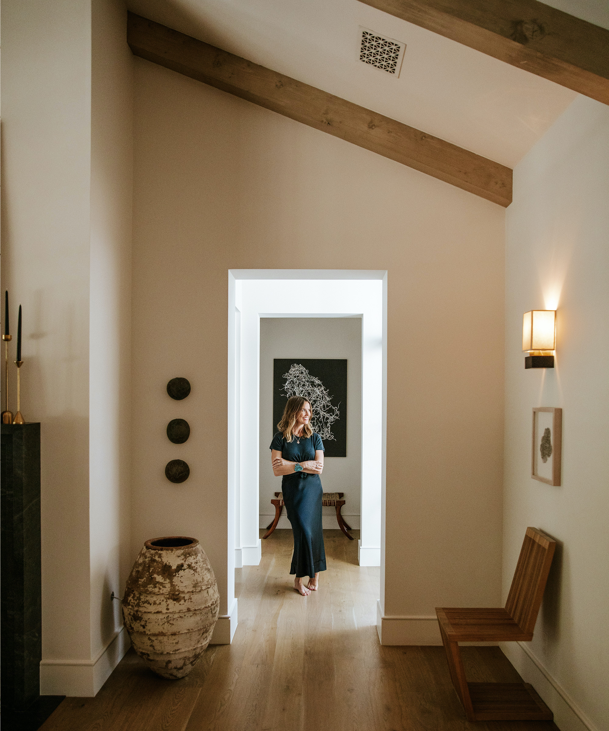 image of emily seiders standing in the hallway of her austin home