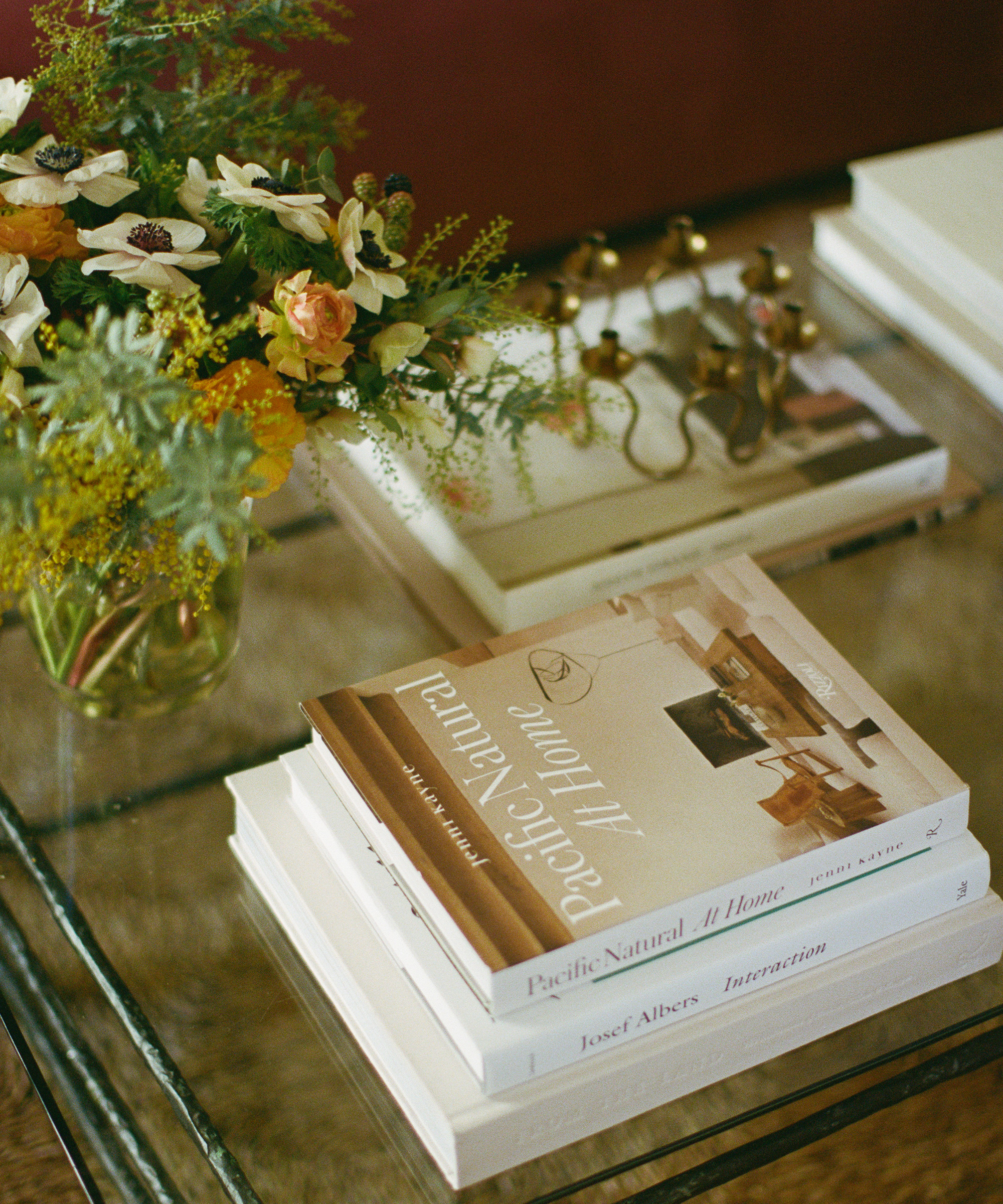 image of jake arnold's coffee table with a copy of pacific natural at home on top