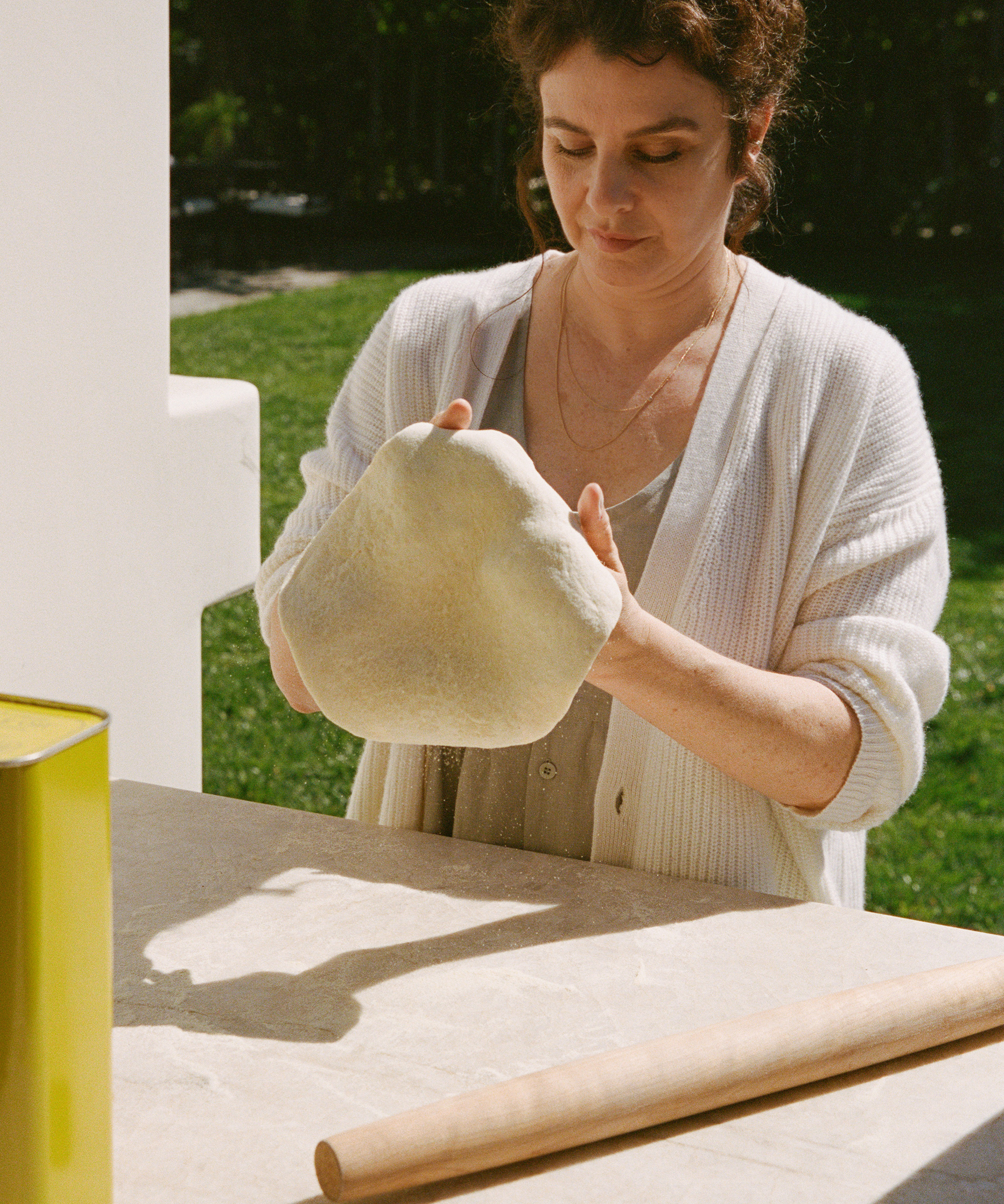 image of leanne citrone making pizza in her backyard