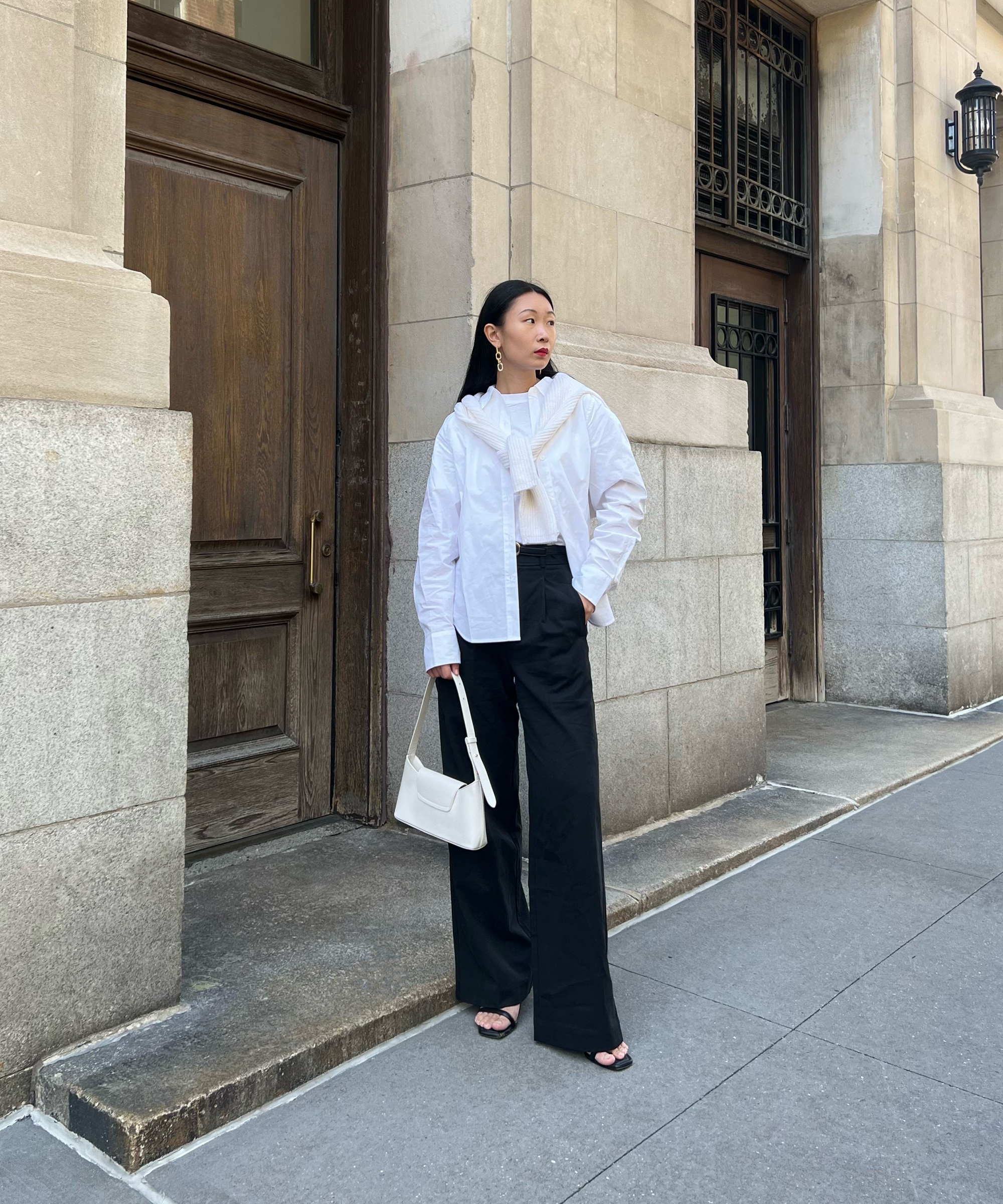 image of caroline lin standing in the street in new york city wearing jenni kayne