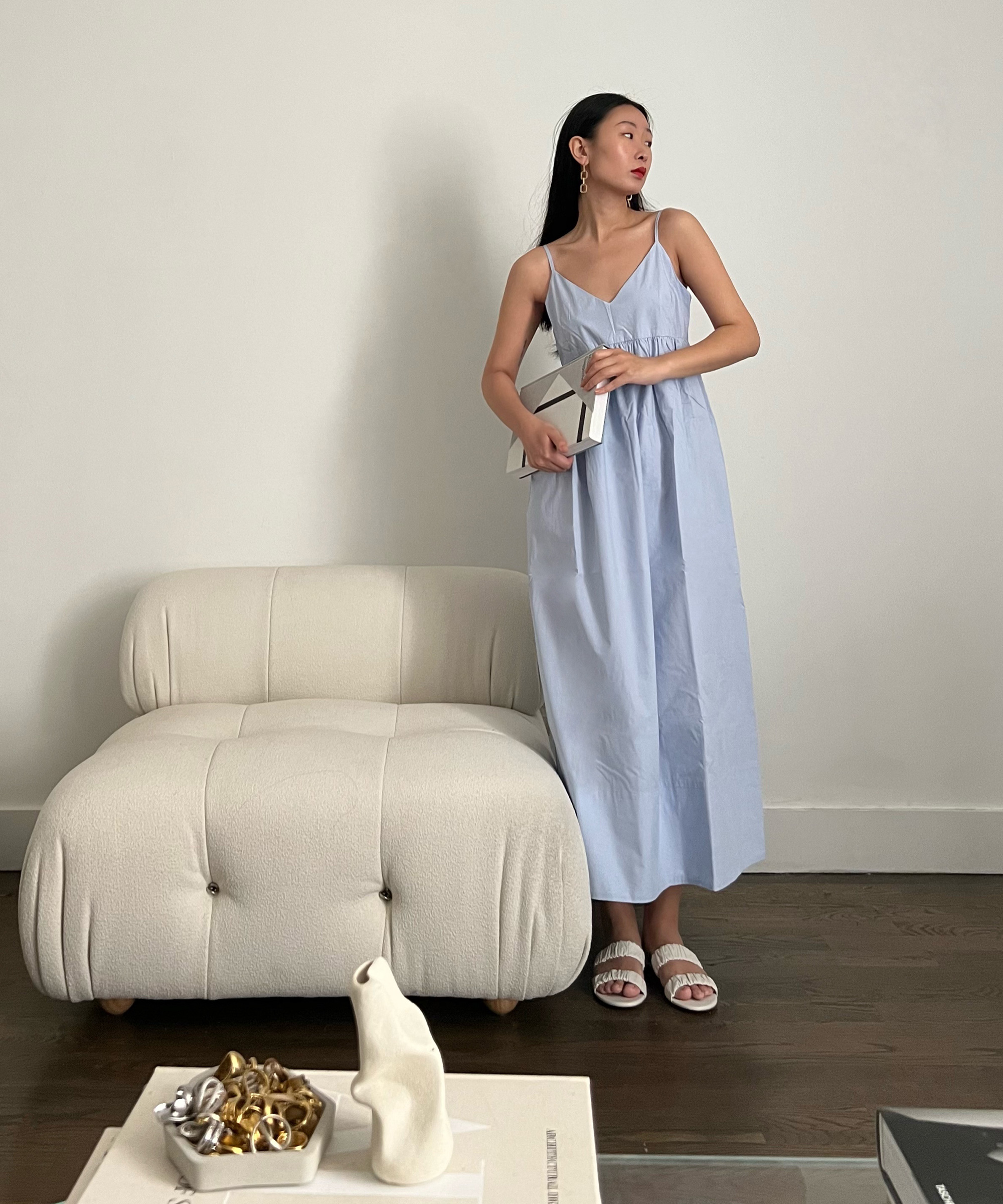 image of caroline lin standing in the street in new york city wearing jenni kayne