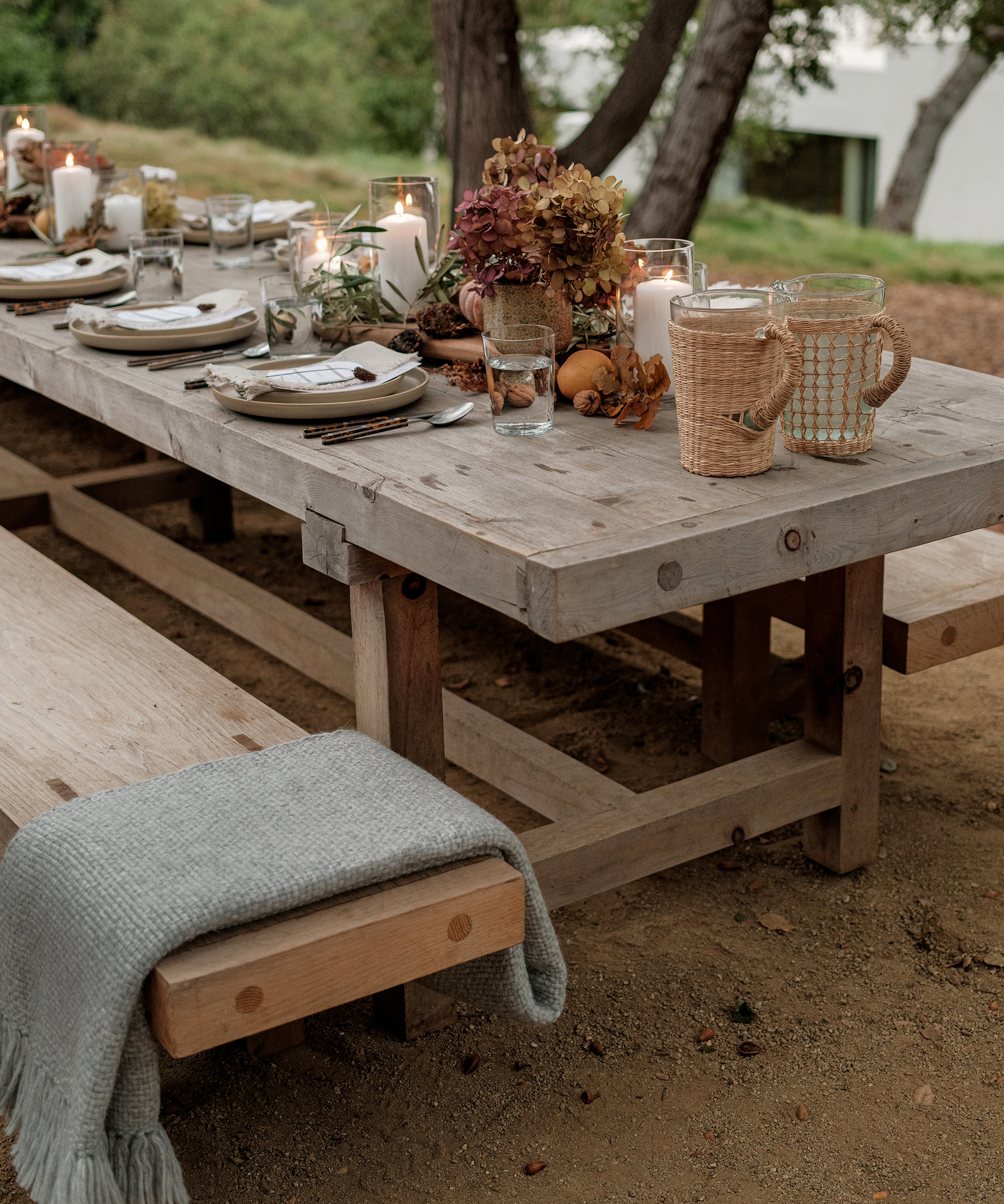 jenni feed dinner party outdoor table setting corner angle with seagrass pitchers