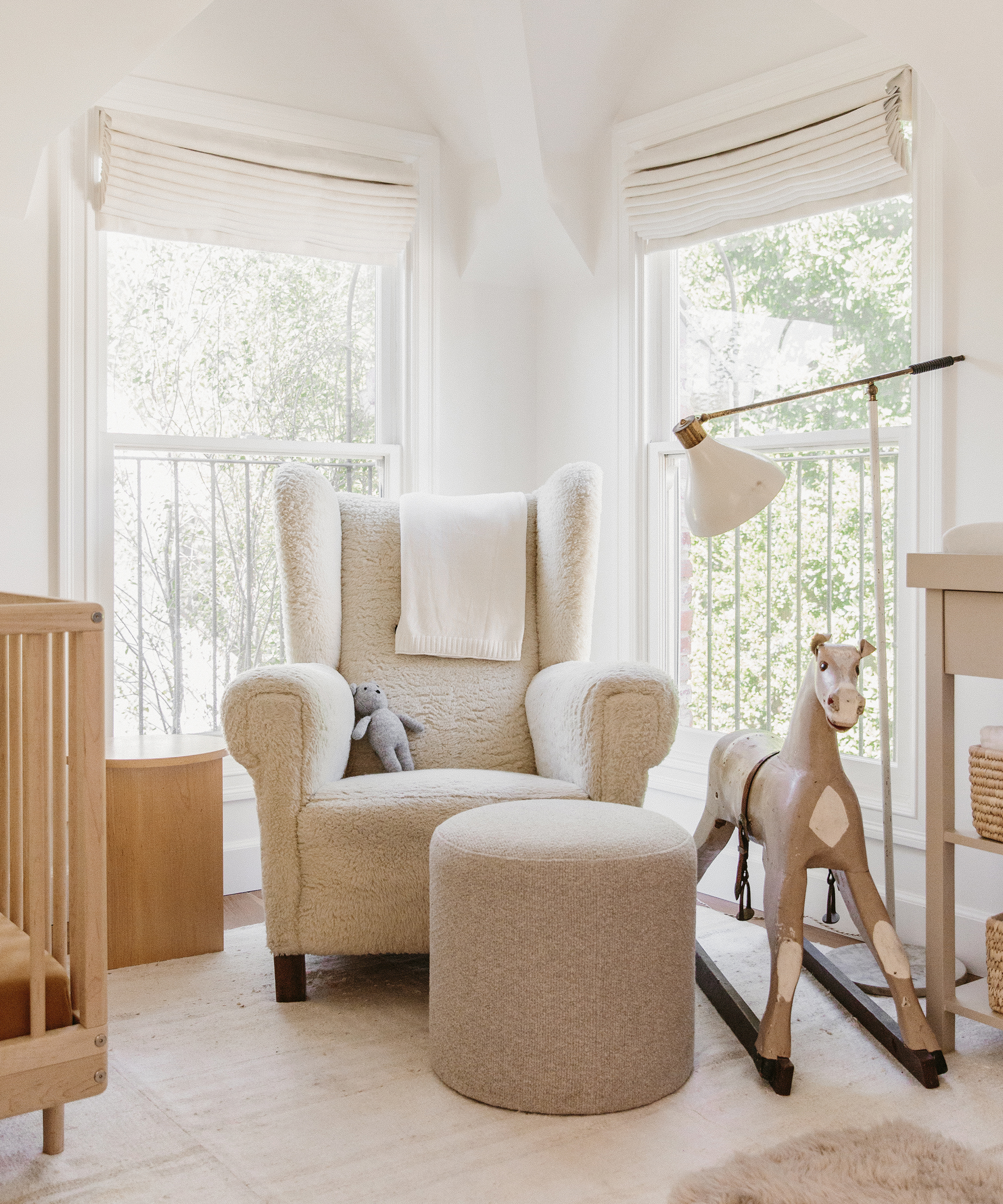 dorianne-passman-jenni-kayne-home-boucle-nursery-chair-corner-rocking-horse