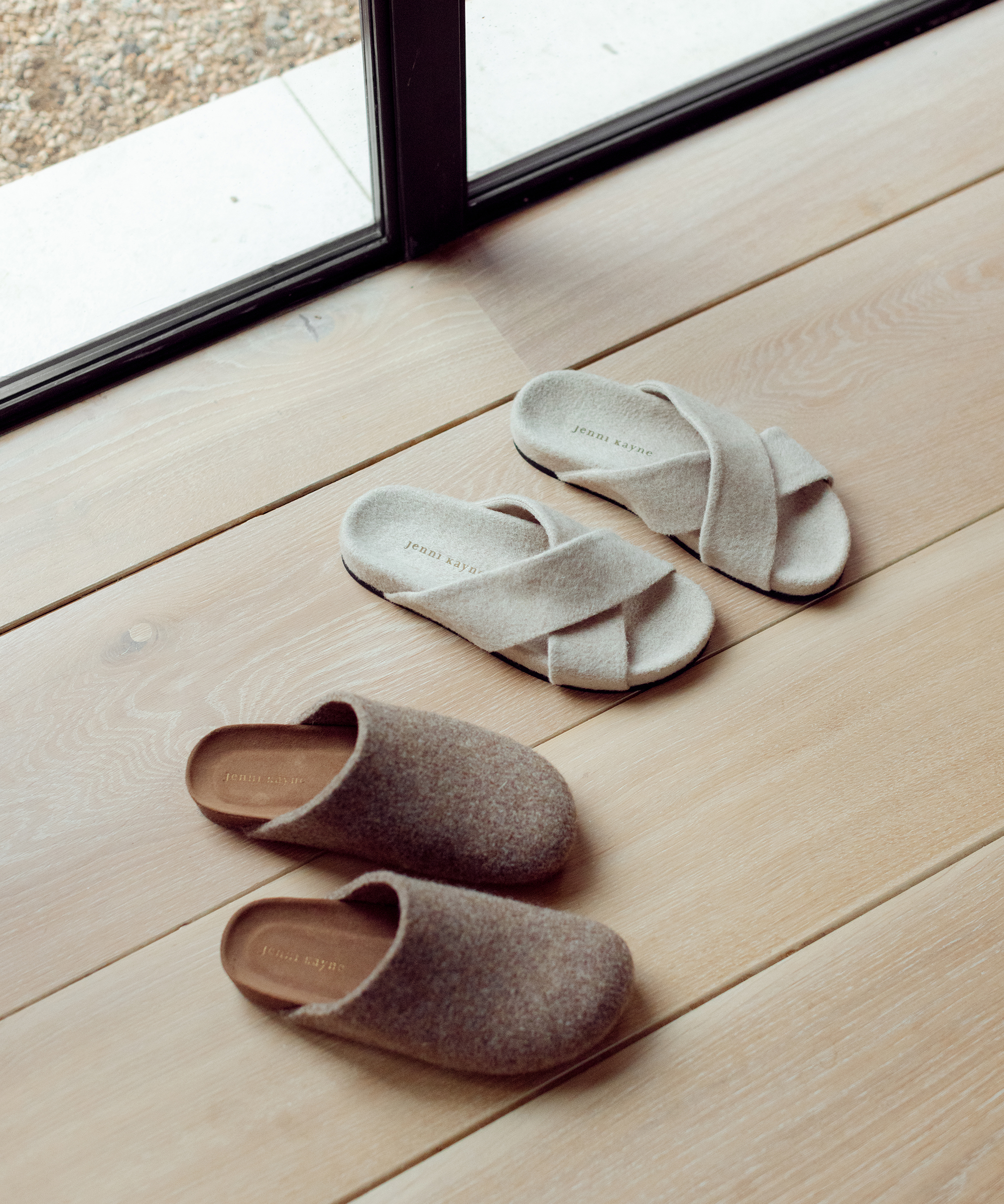 two pairs of shoe on hardwood floor
