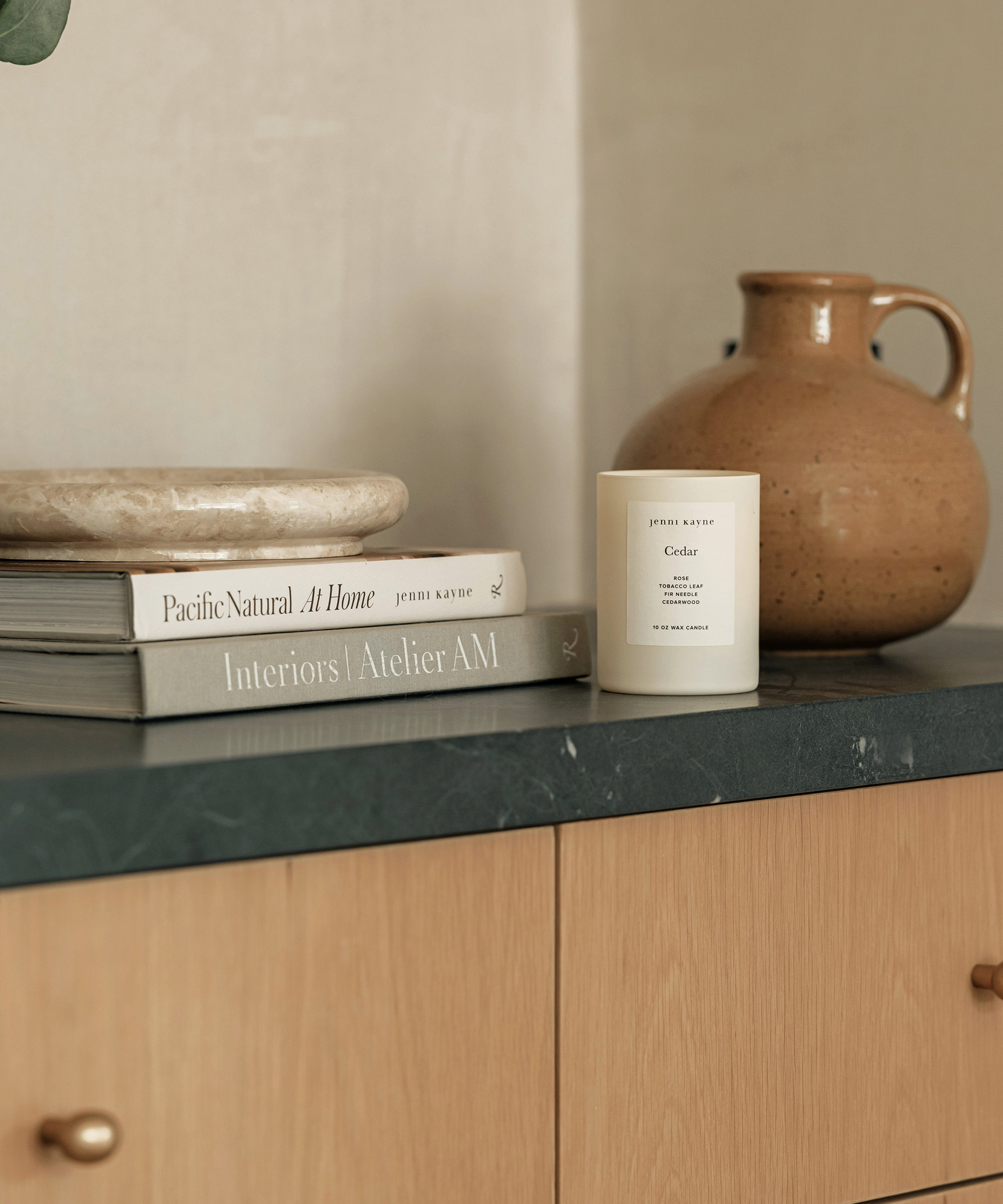 open shelving with decorative accents of coffee table books and ceramic vases