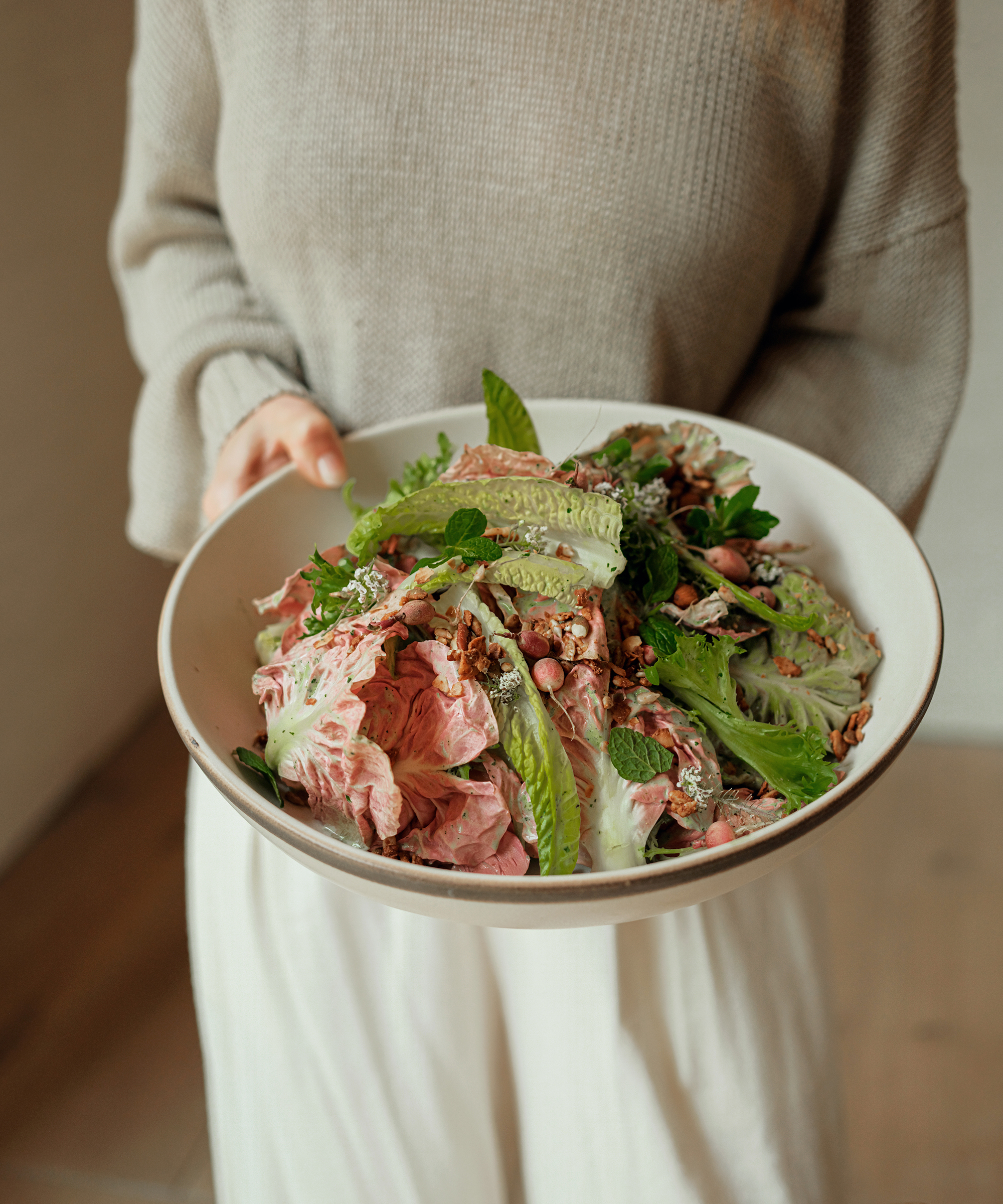 close up photo of a colorful salad in a white serving bowl