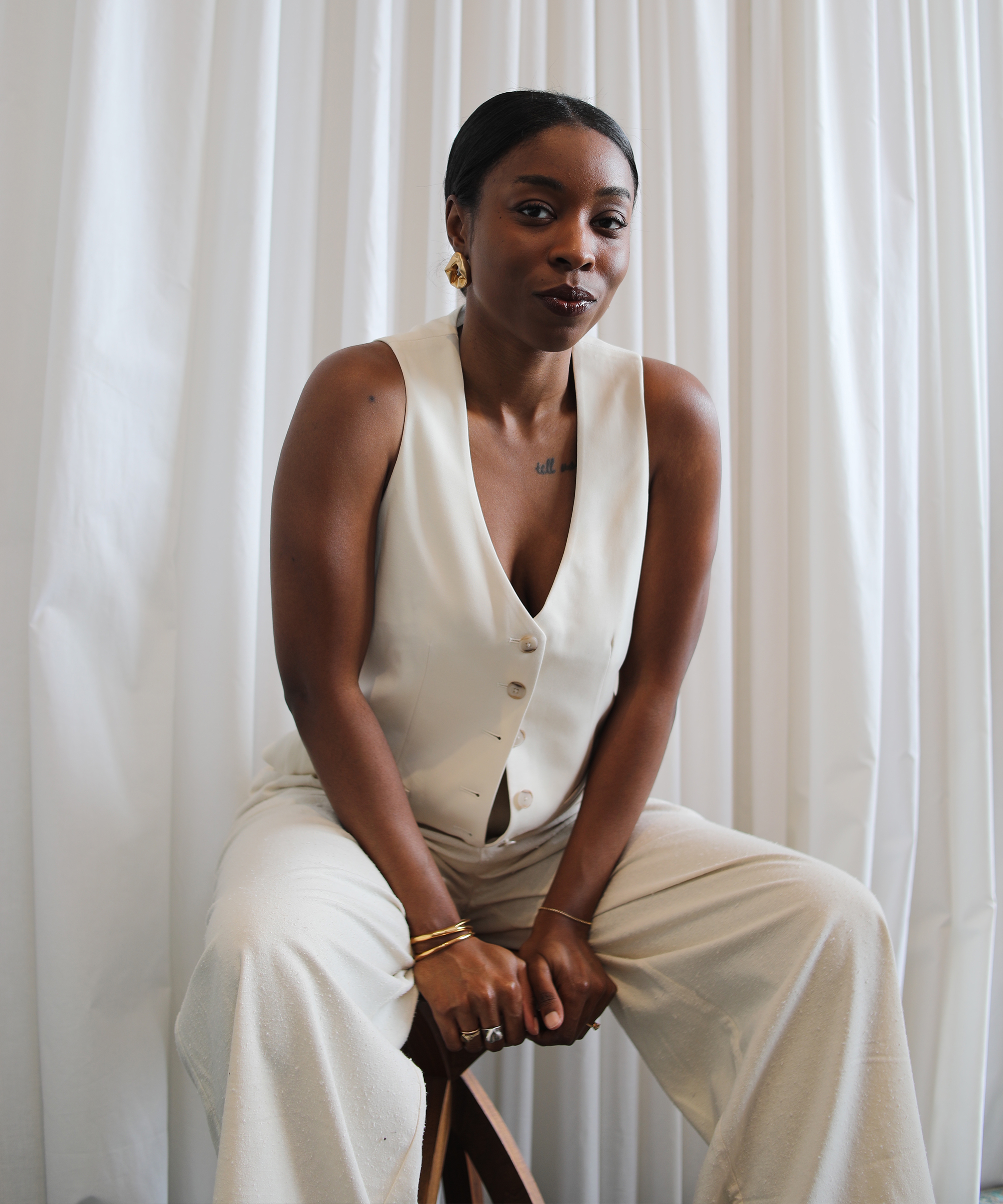cortne-bonilla-in-uniform-ivory-vest-relaxed-trouser