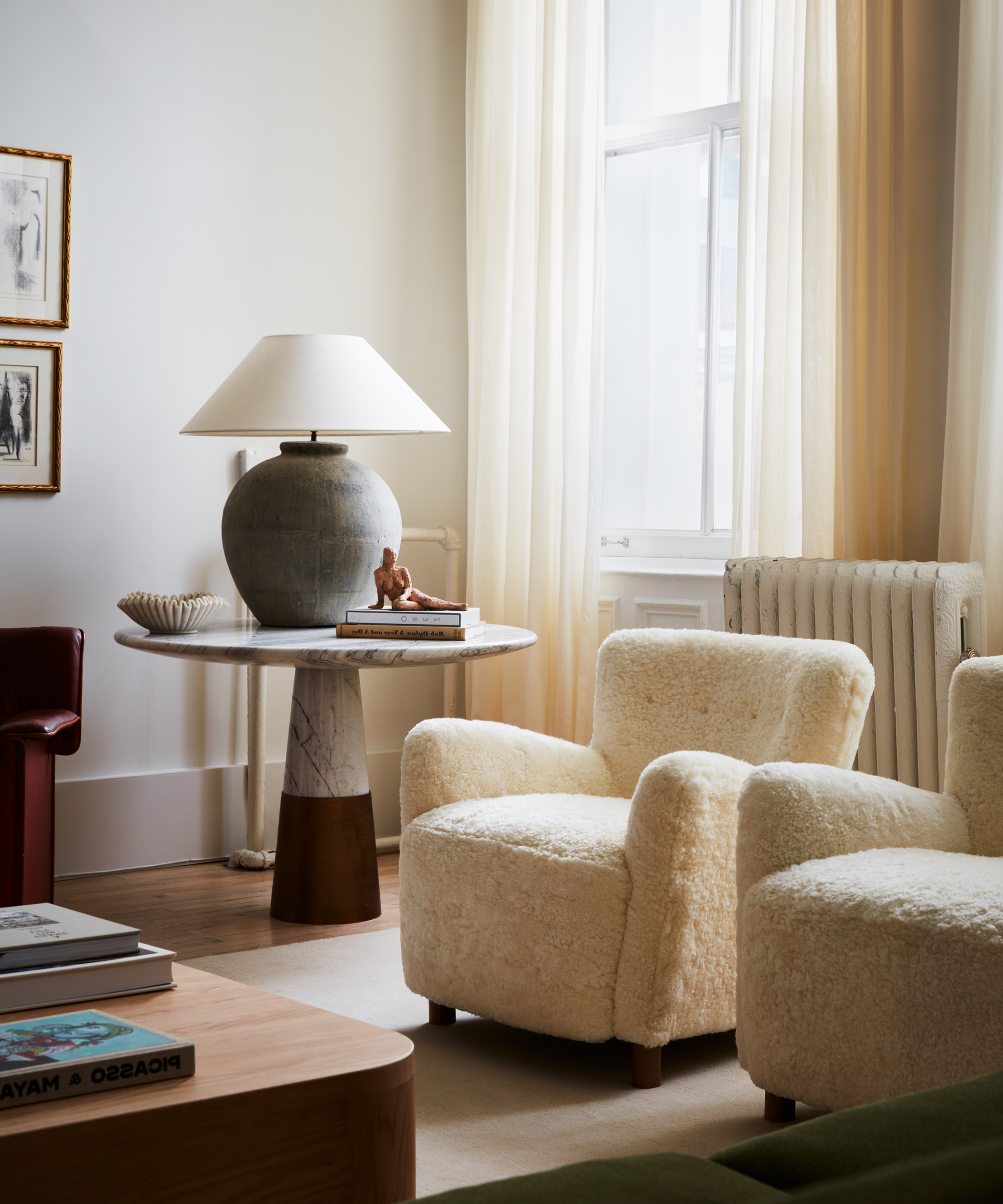 nicholas-obeid-home-tour-ivory-sherpa-accent-chair-stone-table-lamp