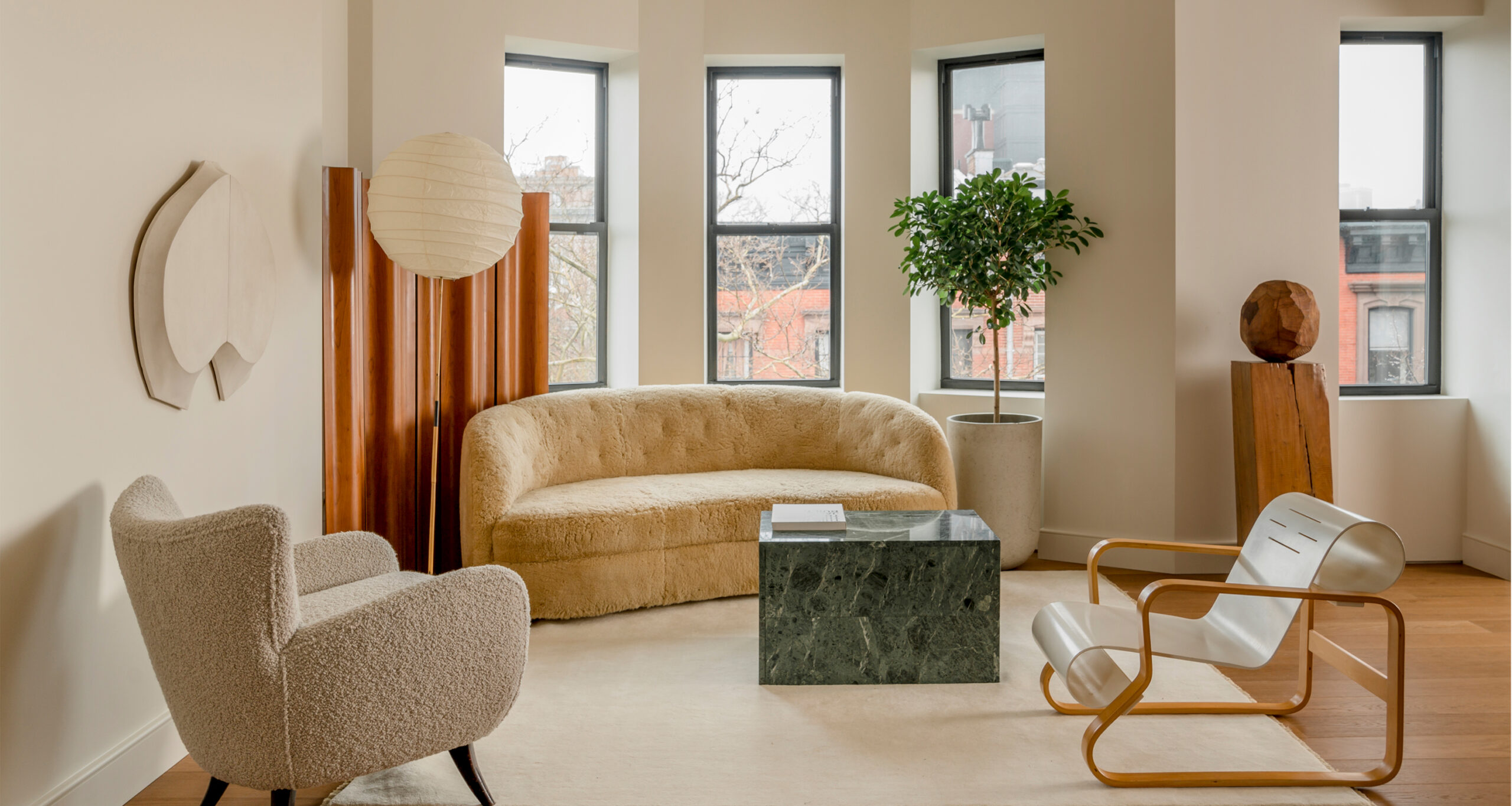 selma-akkari-home-tour-living-room-accent-chairs-curved-couch
