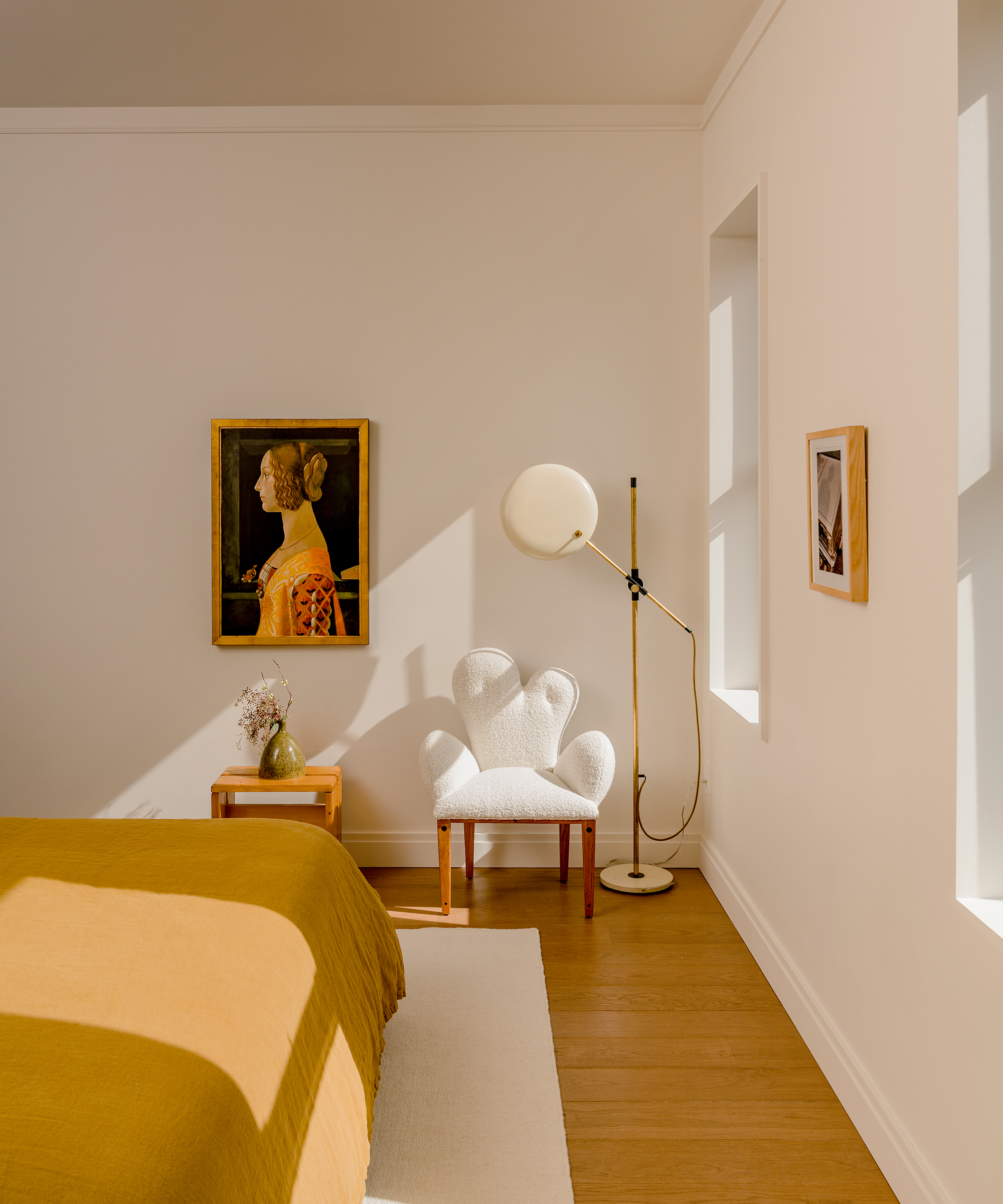selma-akkari-home-tour-yellow-bedroom-curved-accent-chair
