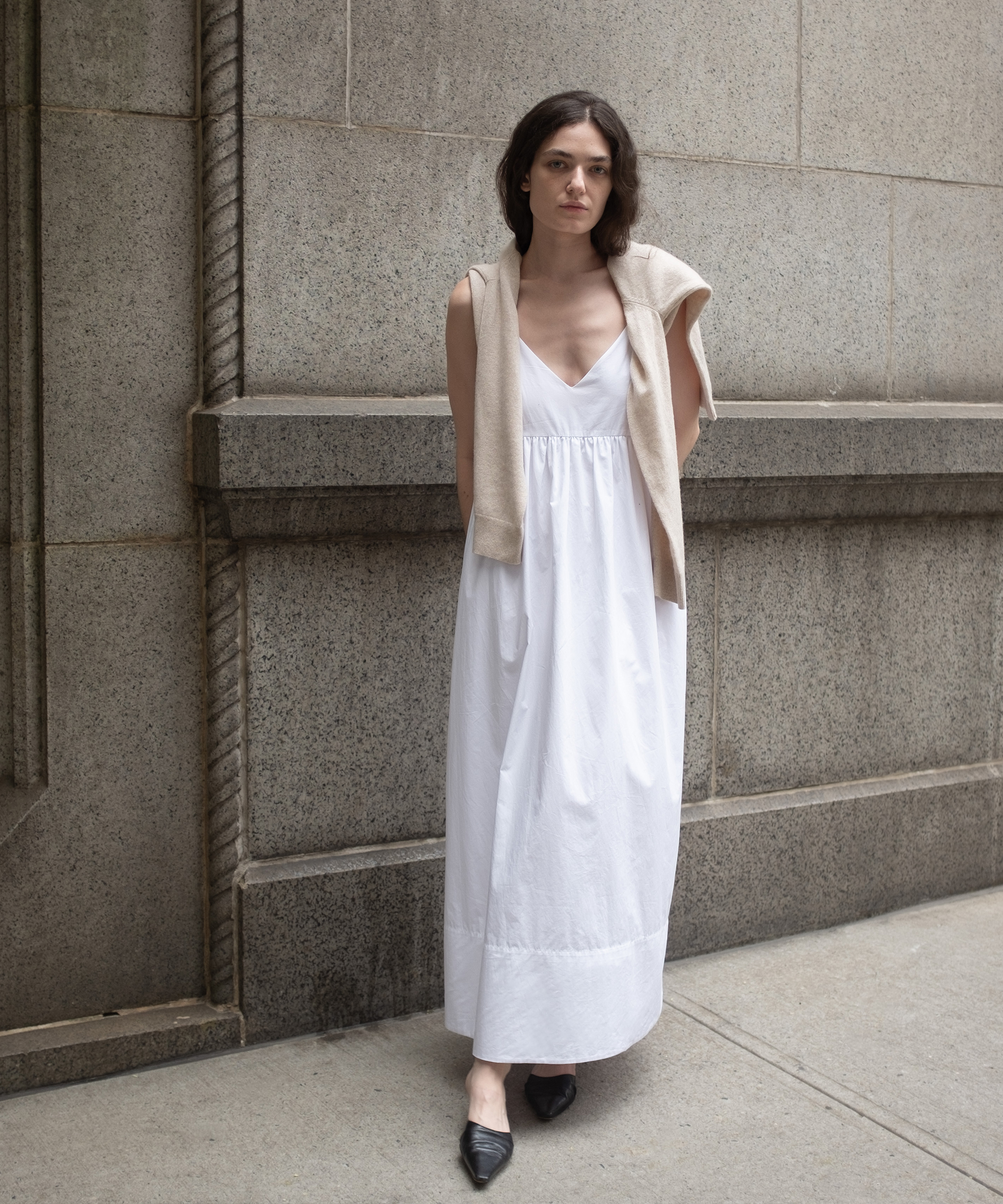 in-uniform-emily-bonita-cove-dress-black-flats-stone-wall