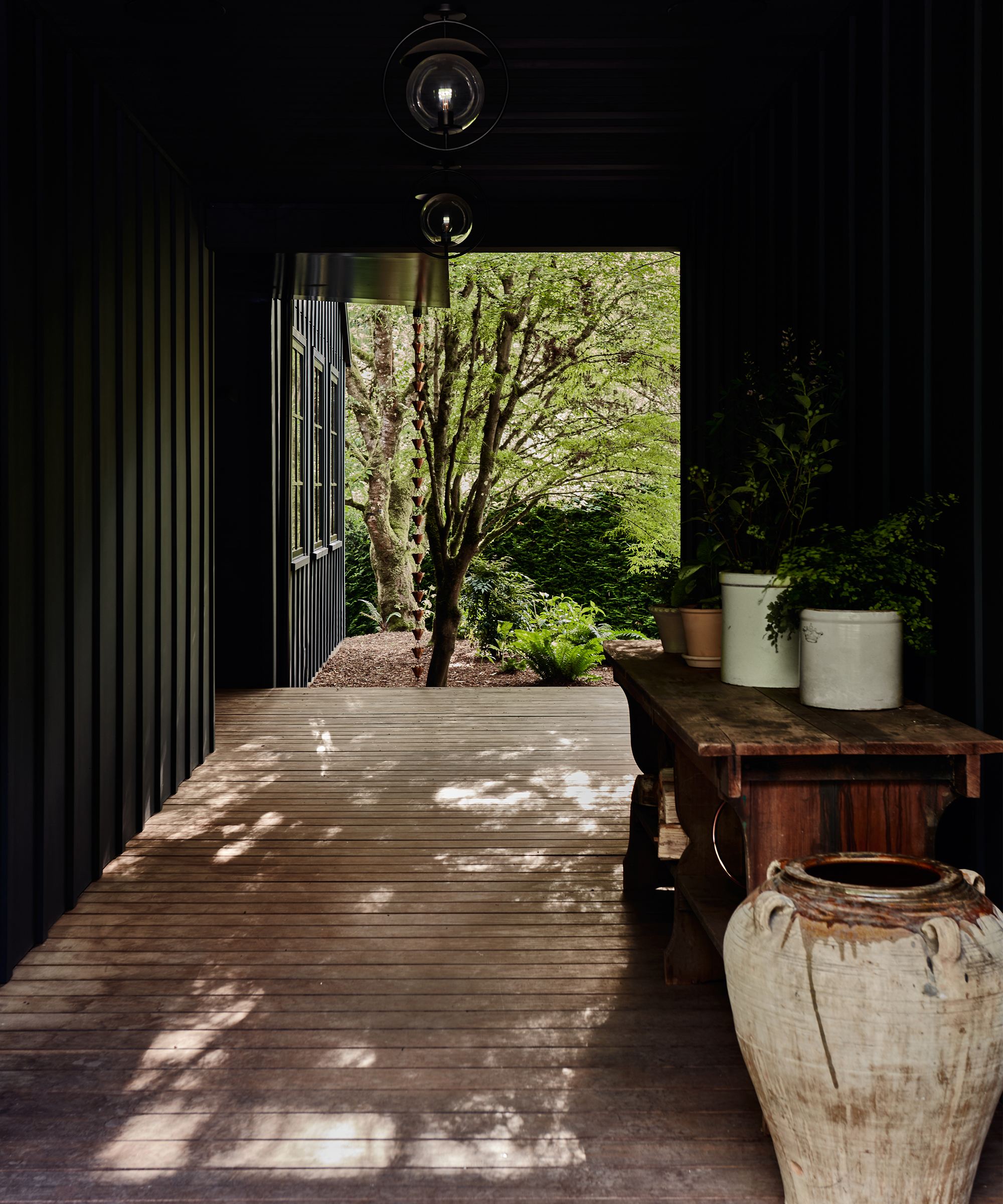 lisa-stanton-home-tour-outdoor-hallway-potted-decor