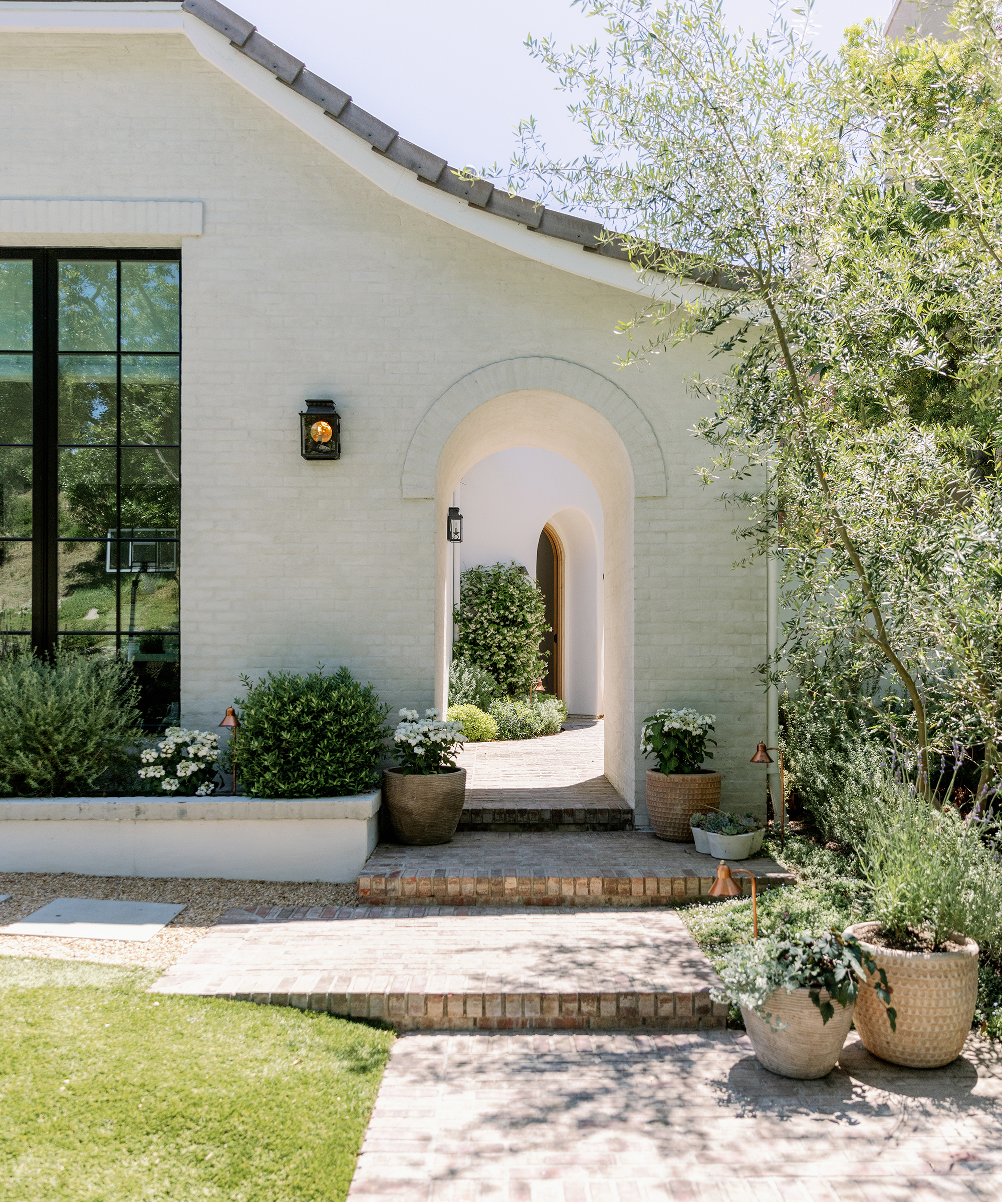 nicole-green-home-tour-outdoor-entrance-white-brick-home