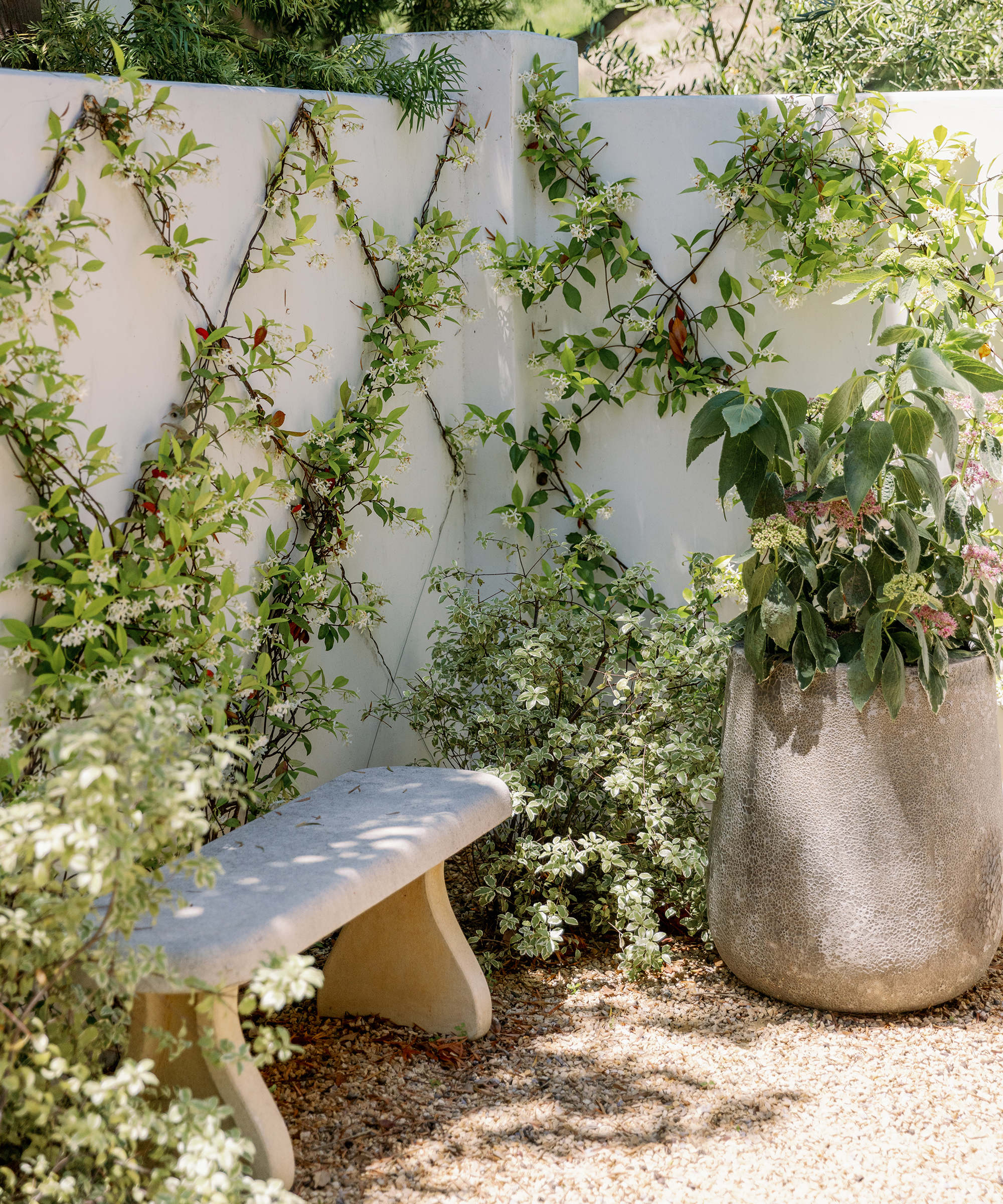 nicole-green-home-tour-outdoor-stone-bench-stone-pot