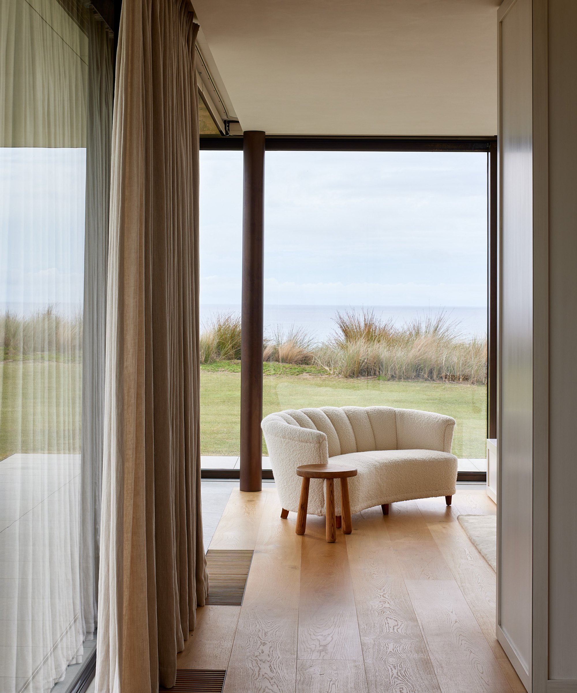 jk-new-zealand-home-tour-boucle-couch-bedroom-hallway