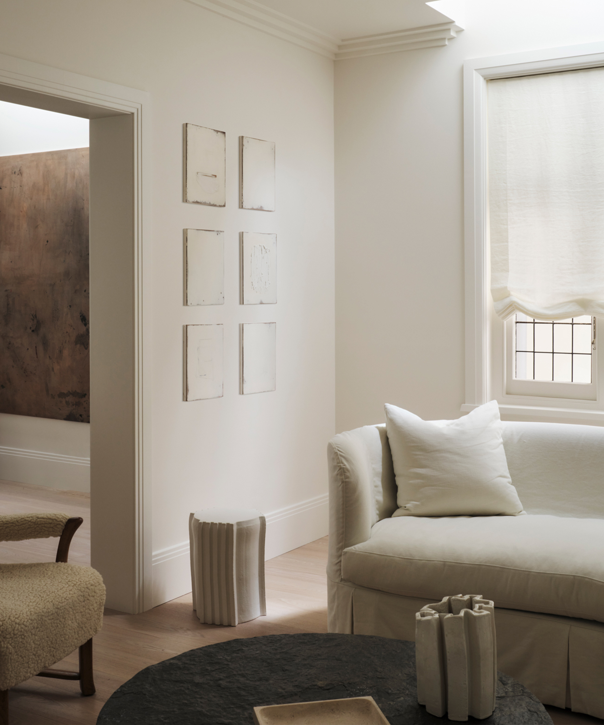 phoebe-nicol-home-tour-living-room-couch-corner-art