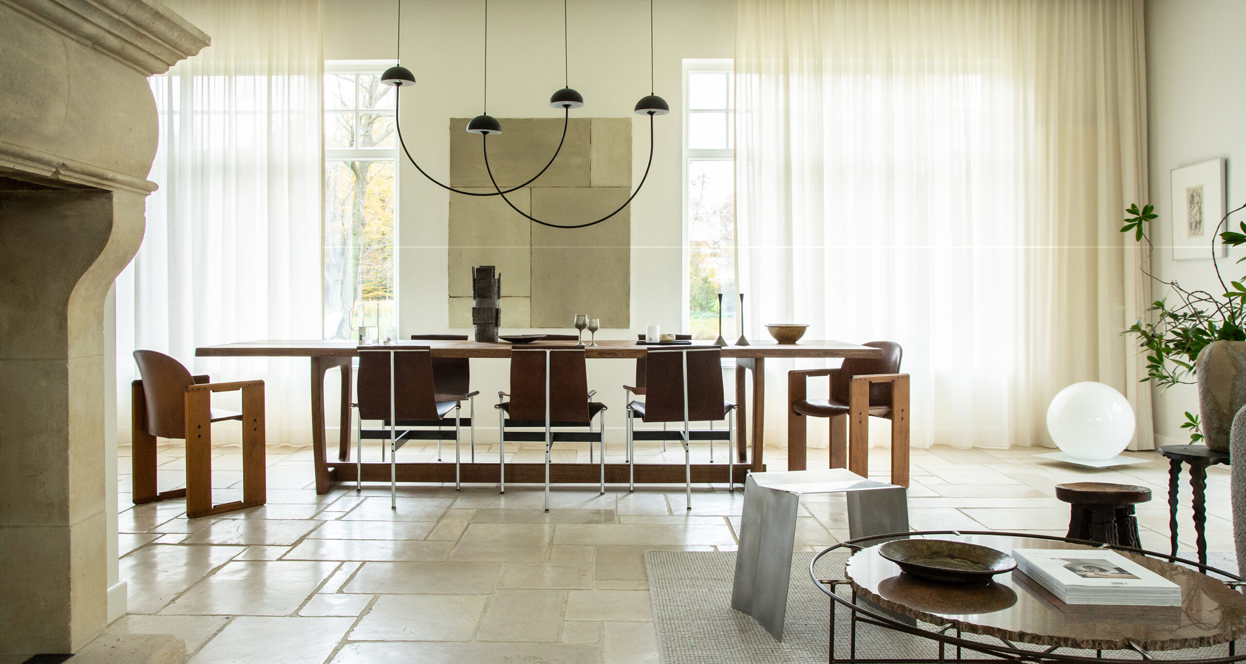 kate-davidson-home-tour-dining-room-long-wood-table-leather-dining-chairs