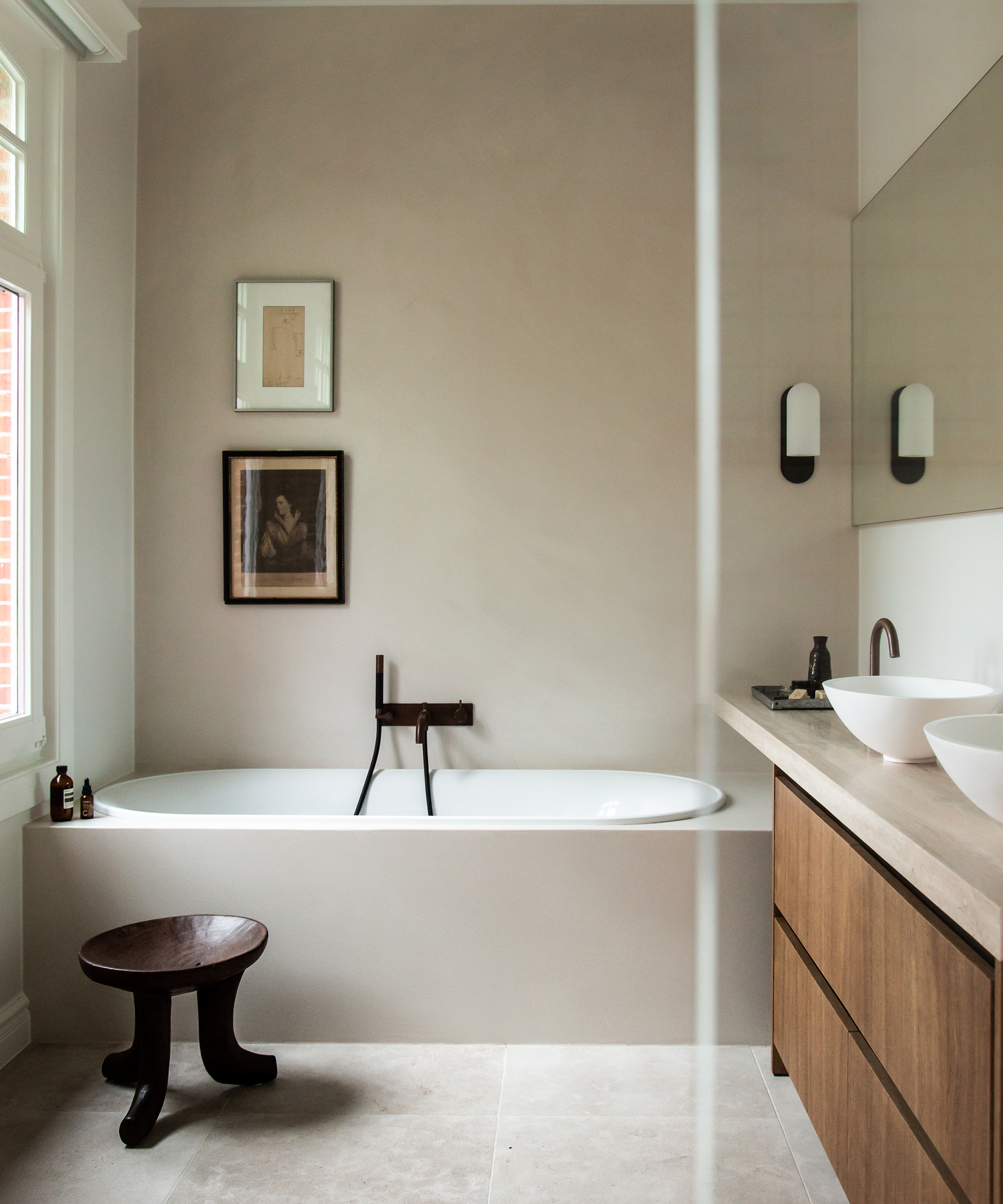 kate-davidson-home-tour-primary-bathroom-stone-tub-plaster-walls
