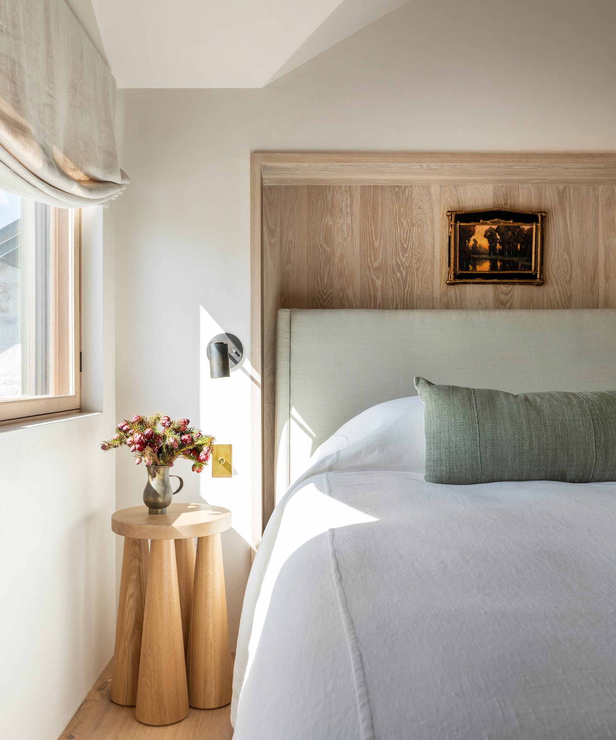 marie-flanigan-home-tour-blue-headboard-wooden-side-table