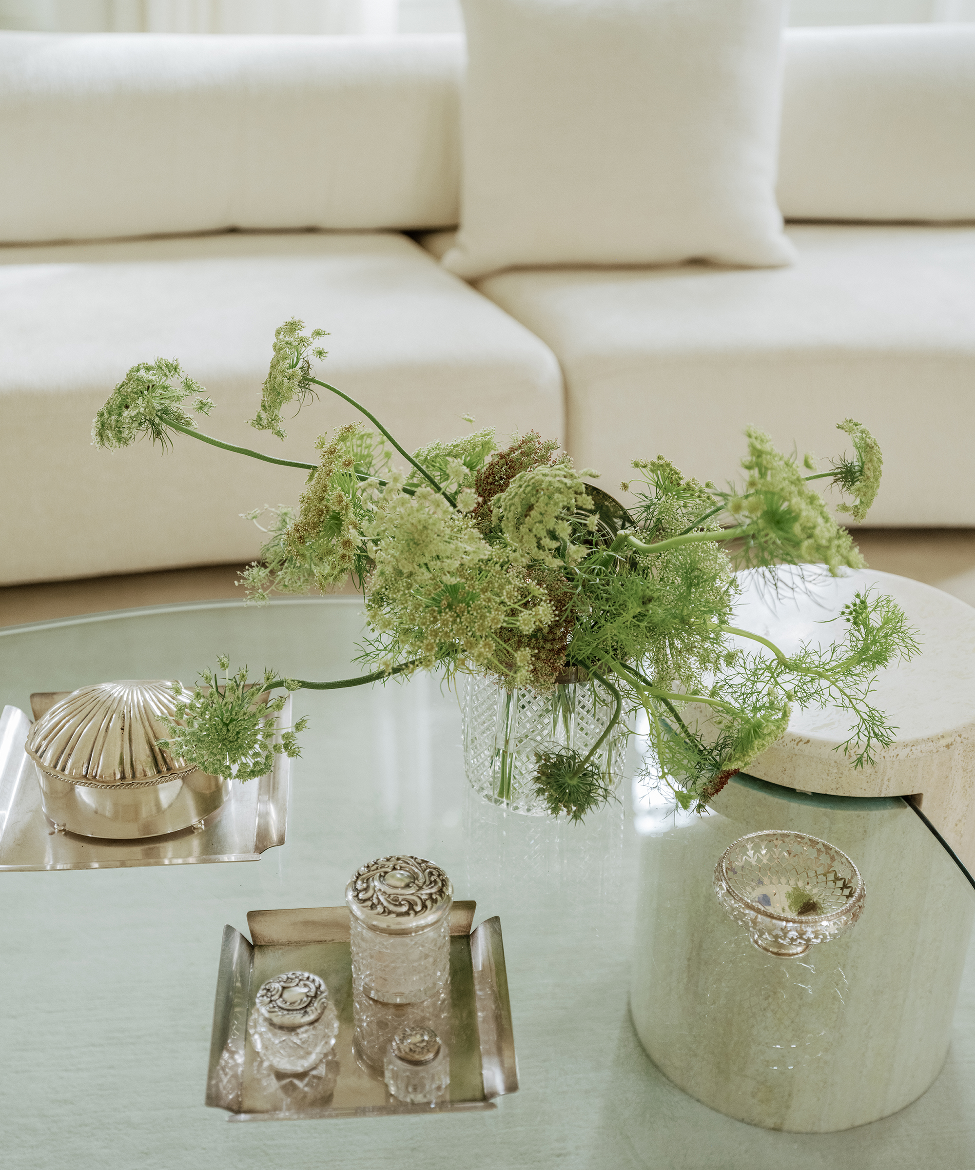 kelly-barnhart-home-tour-coffee-table-silver-decor-green-flowers