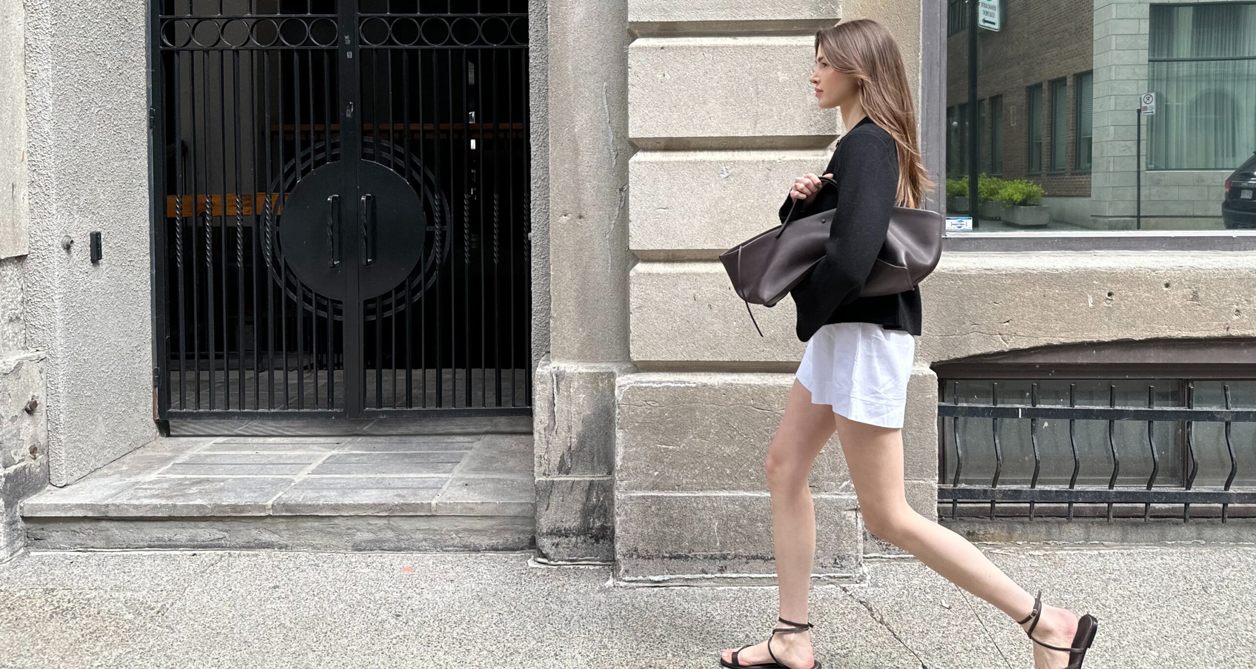 anna-porte-in-uniform-black-cooper-cardigan-walking-street-h
