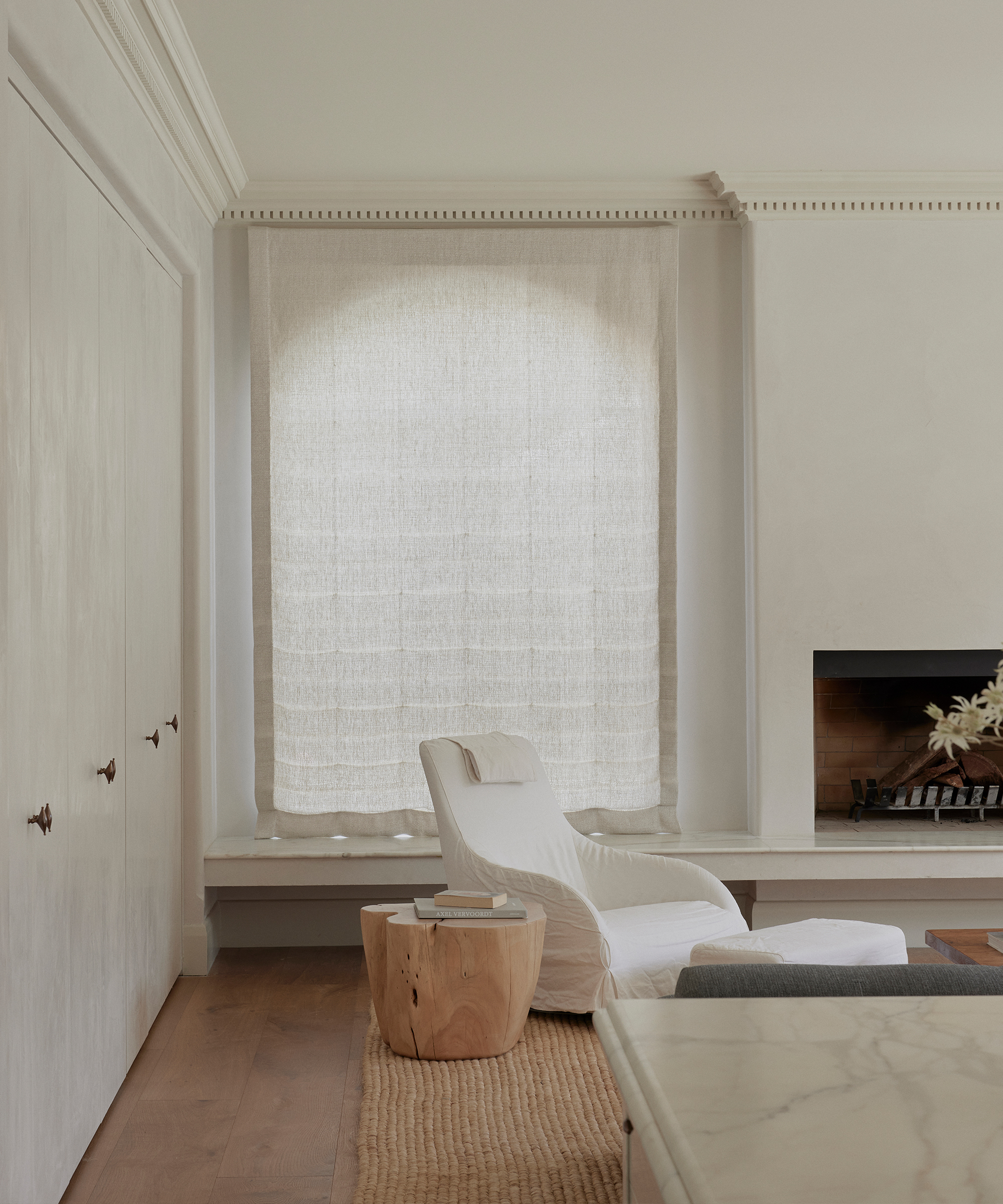 emily-gillis-home-tour-living-room-white-slipcover-accent-chair