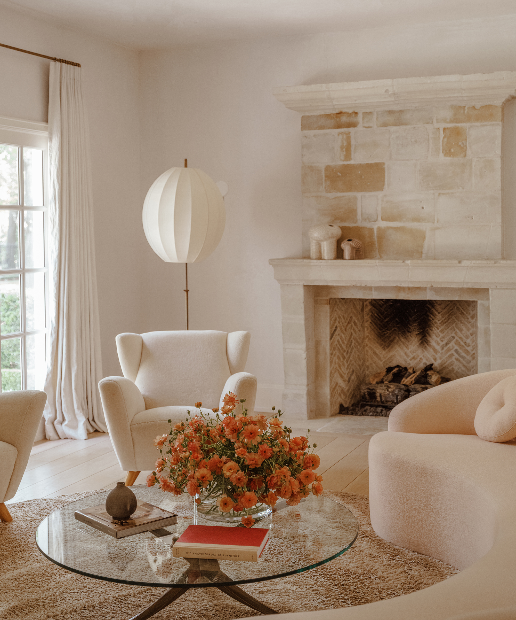 mnaeve-home-tour-living-room-curved-sofa-ivory-accent-chairs