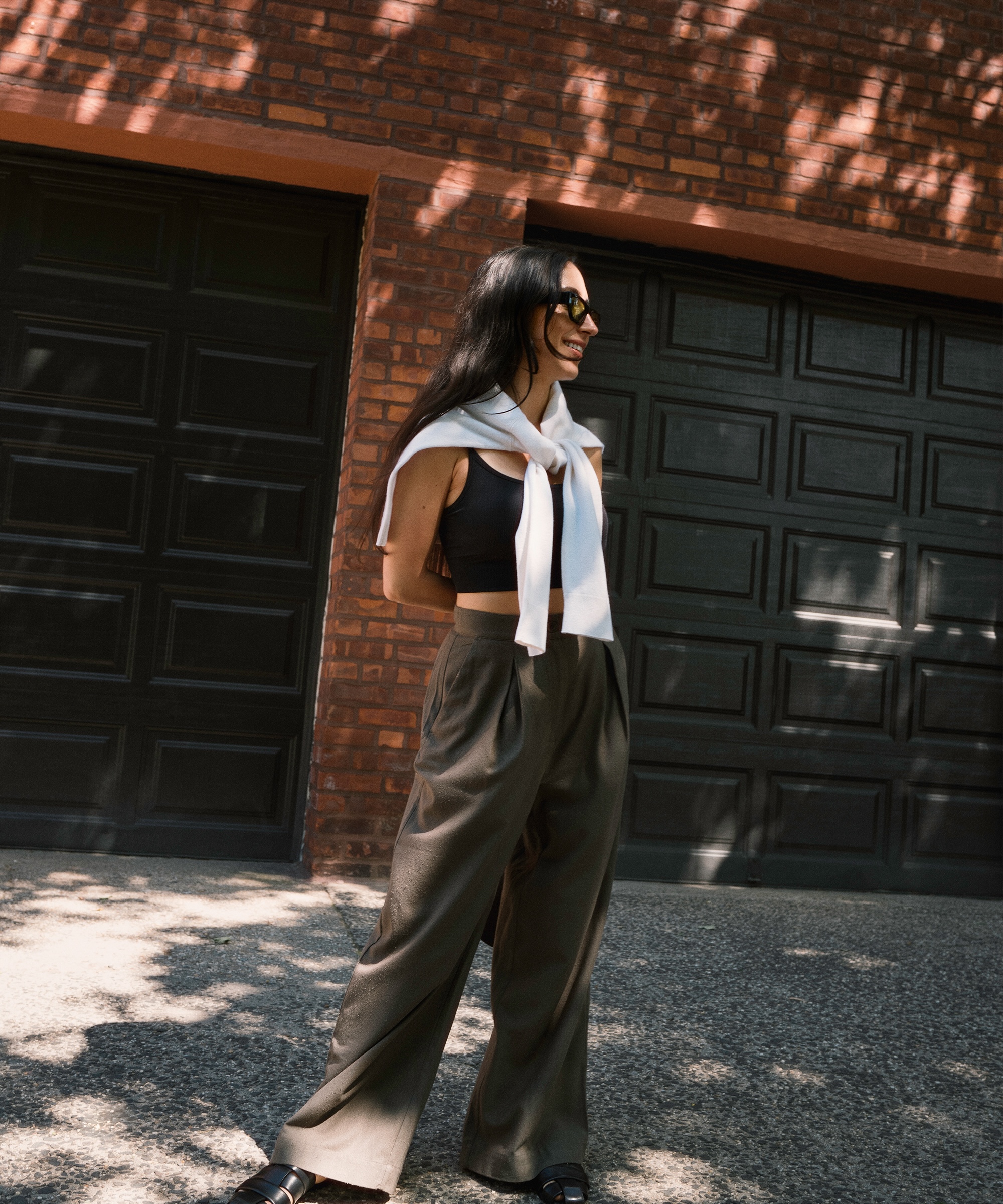 alexis-badiyi-in-uniform-relaxed-trousers-garage-door