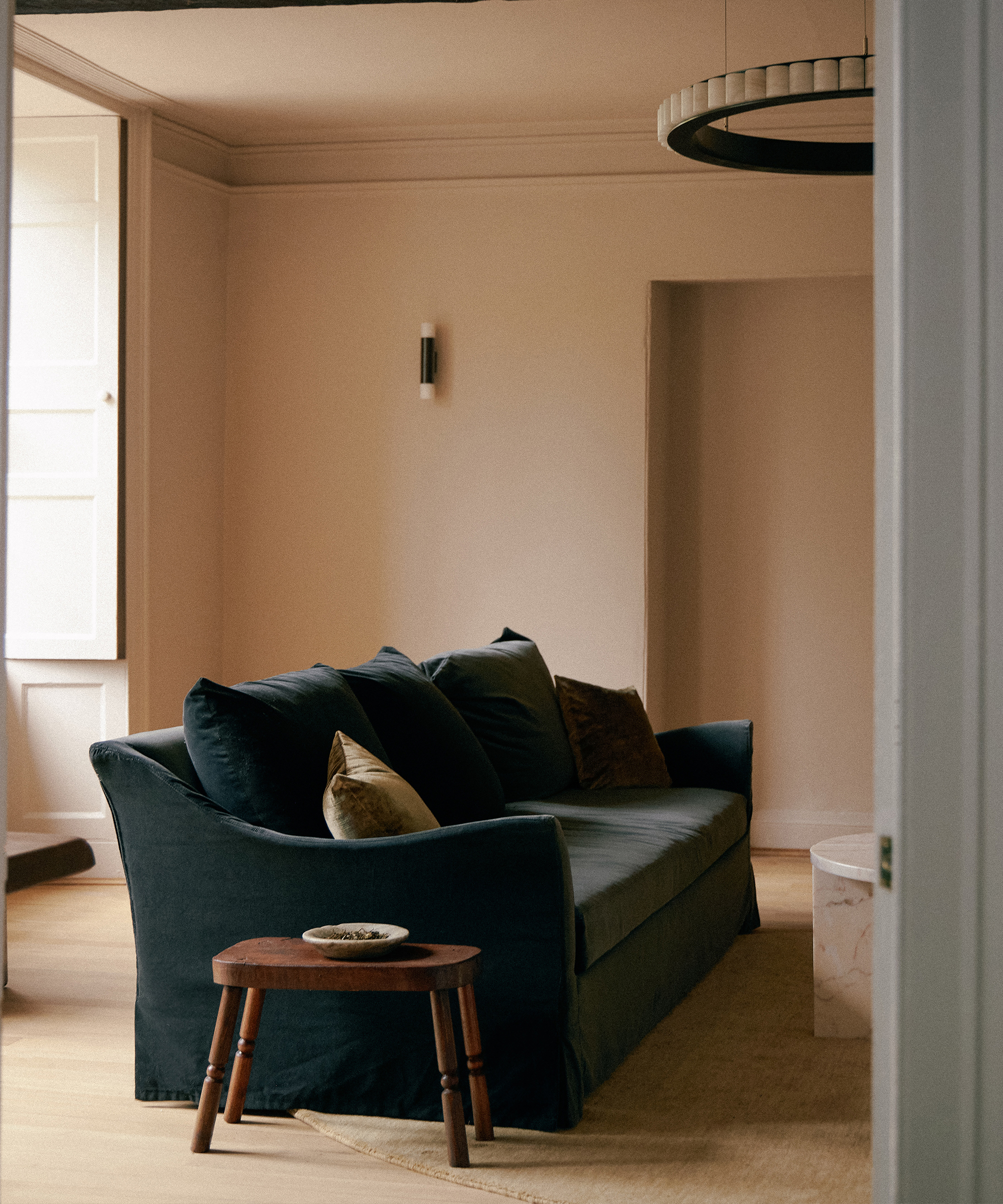 lauren-olivia-design-home-tour-blue-velvet-couch-wooden-side-table