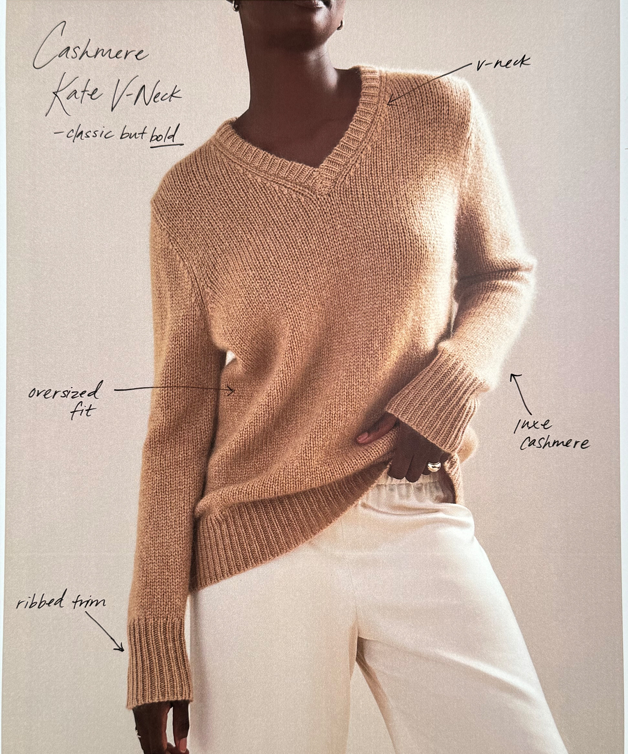 a photo of a woman wearing the cashmere kate vneck with handwriting explaning how it is made