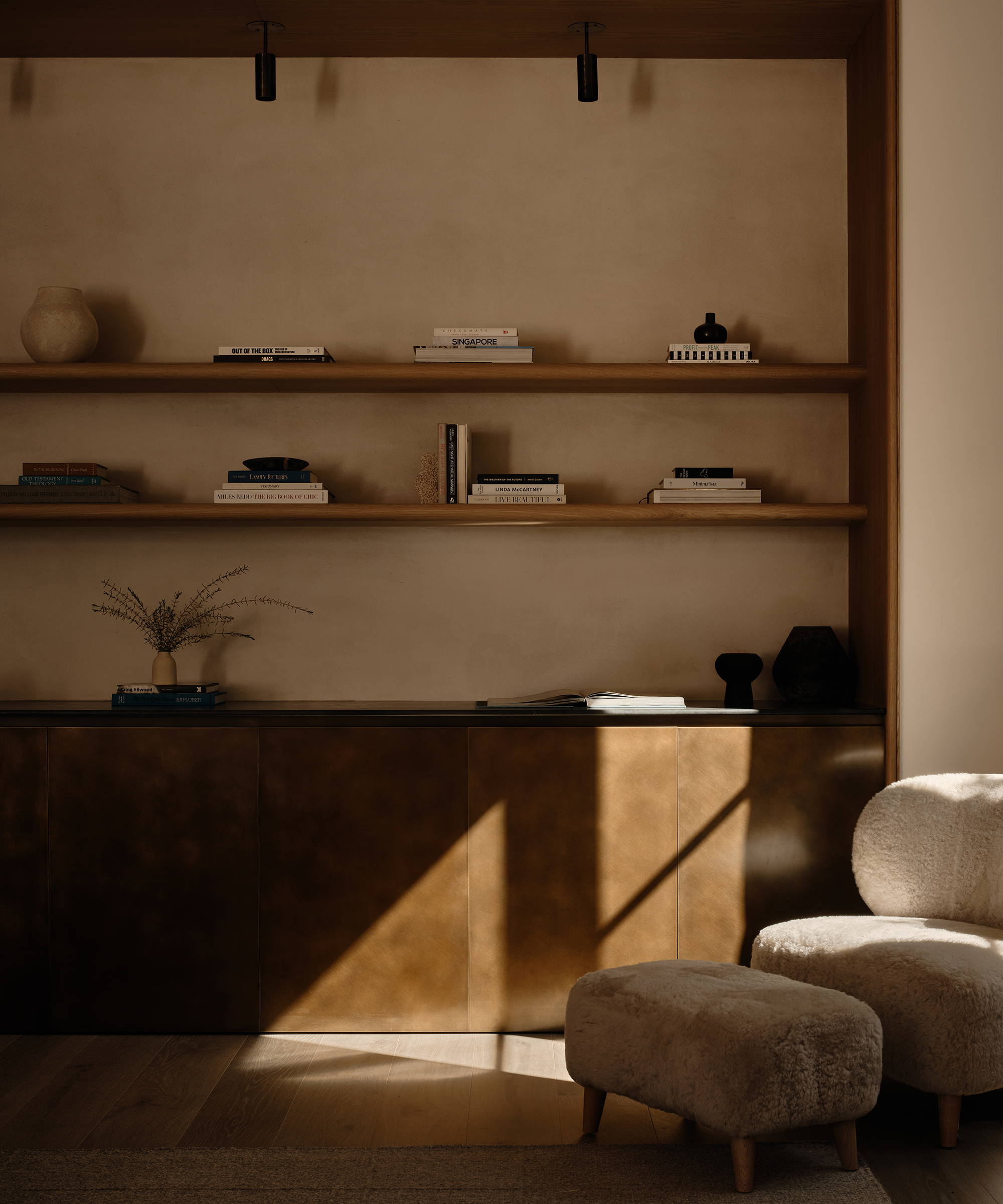 a living room nook with open shelving and metal cabinets