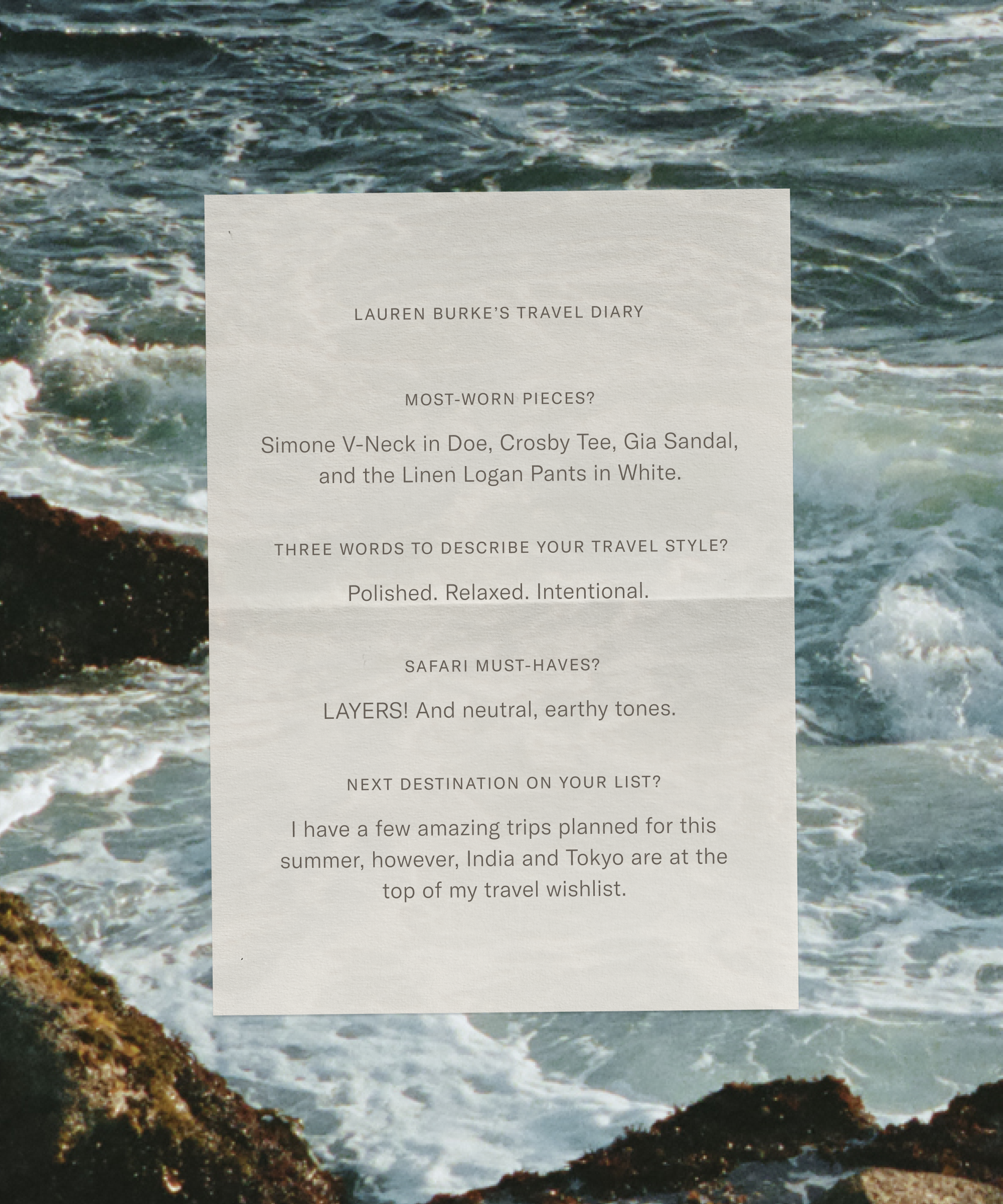 A sheet of paper with Lauren Burke’s travel diary is overlaid on a rocky ocean shoreline. Lauren Burke lists favorite clothing items, travel style words, must-have safari essentials, and future travel destinations.
