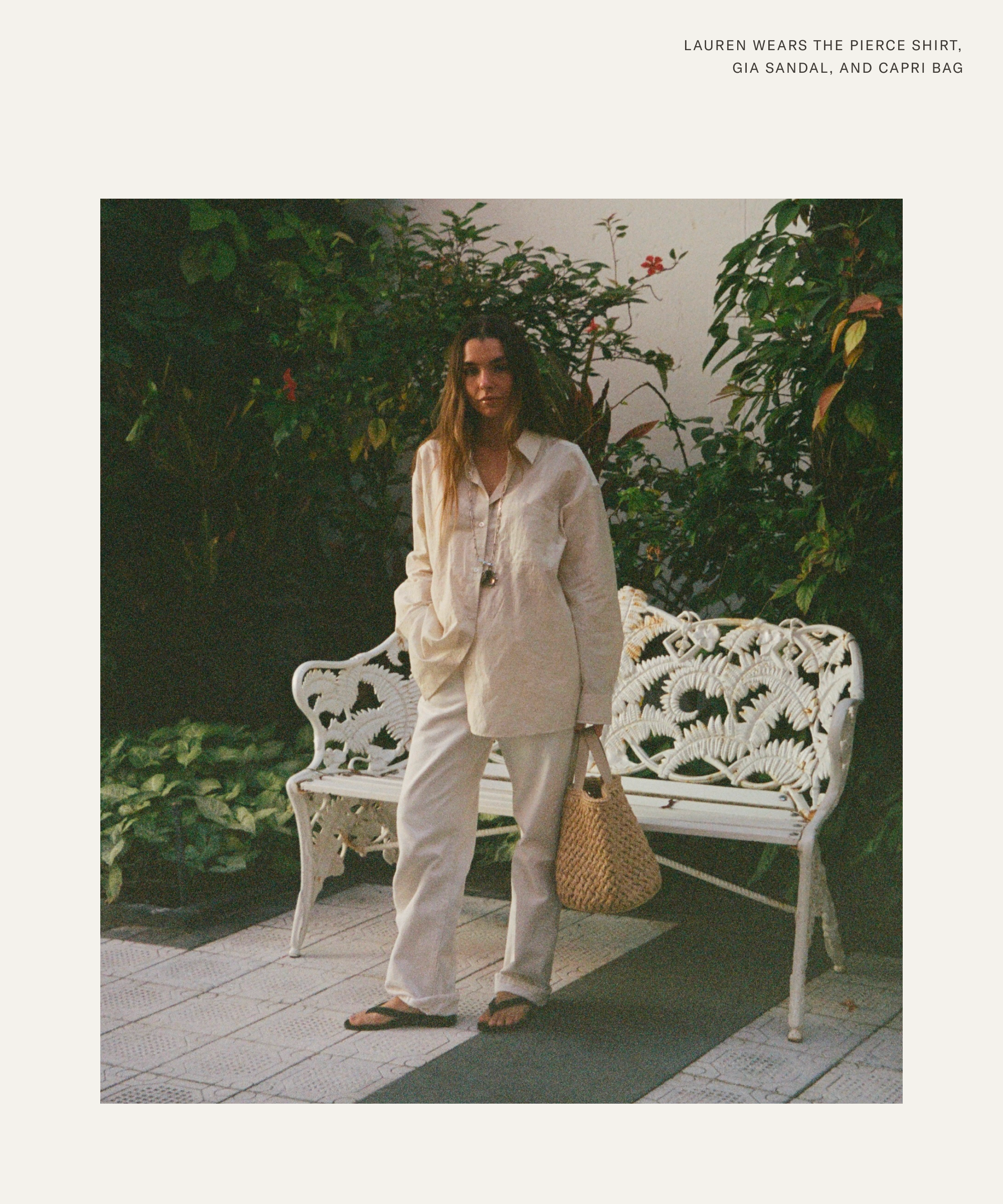 lauren wearing a button up and white denim outside in front of a white iron bench