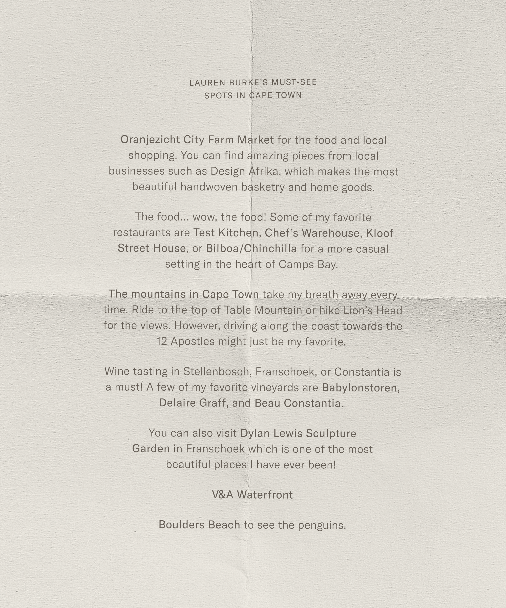 A typed list titled Lauren Burke’s Must-See Spots in Cape Town highlights local markets, top restaurants, majestic mountains, wine tasting venues, a sculpture garden, the V&A Waterfront, and Boulders Beach to see penguins.