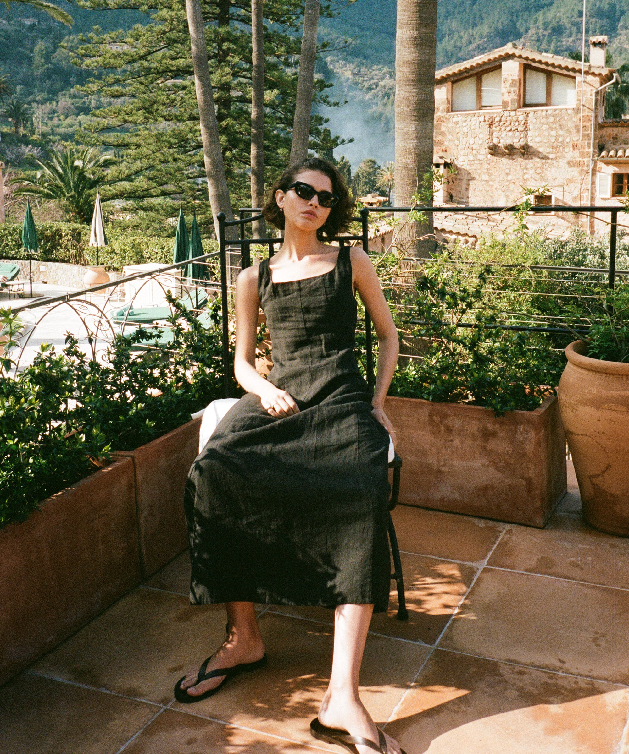 behind-the-campaign-destination-kinney-dress-sitting-outside-chair