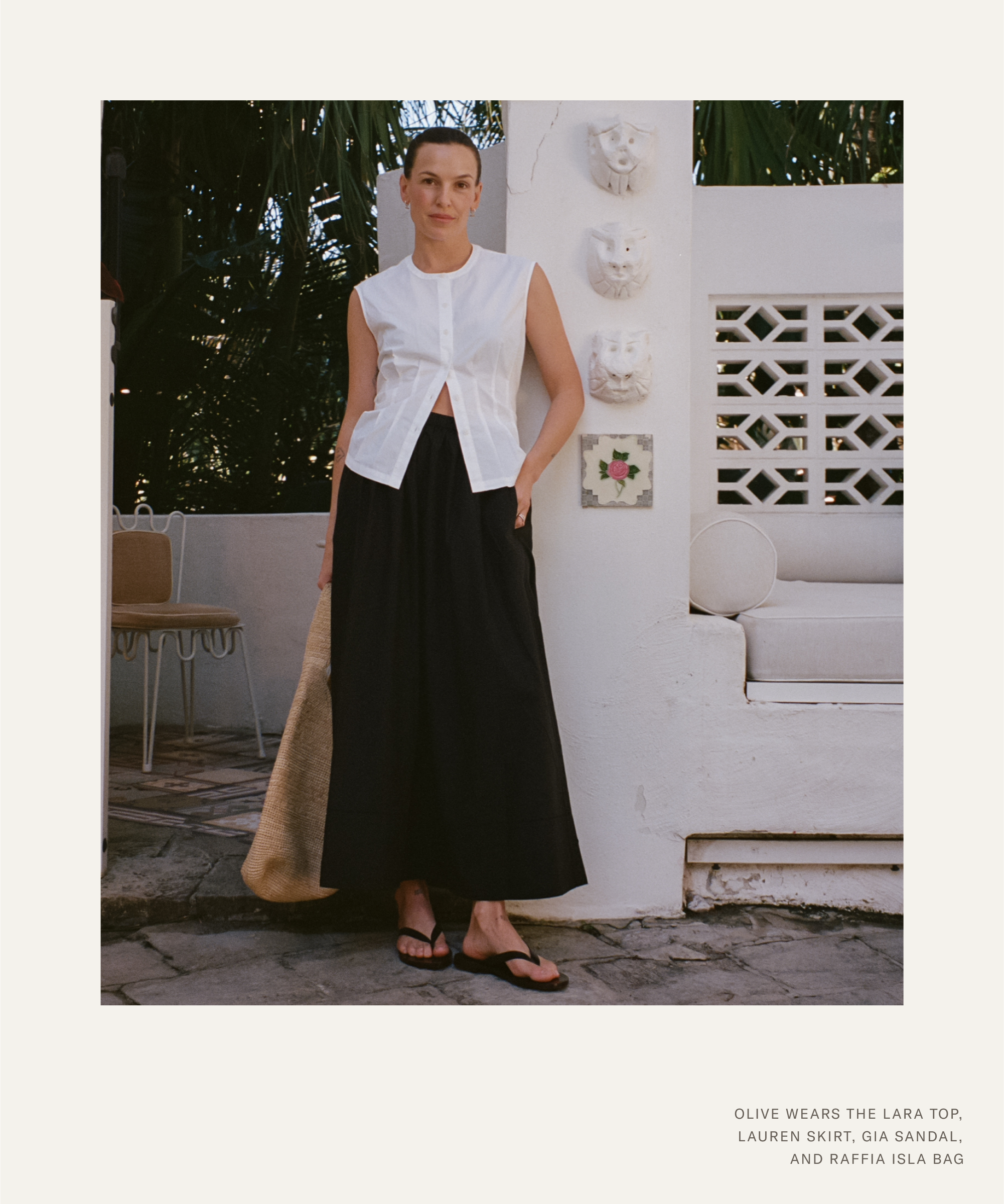 olive wearing a white button up top and black maxi skirt