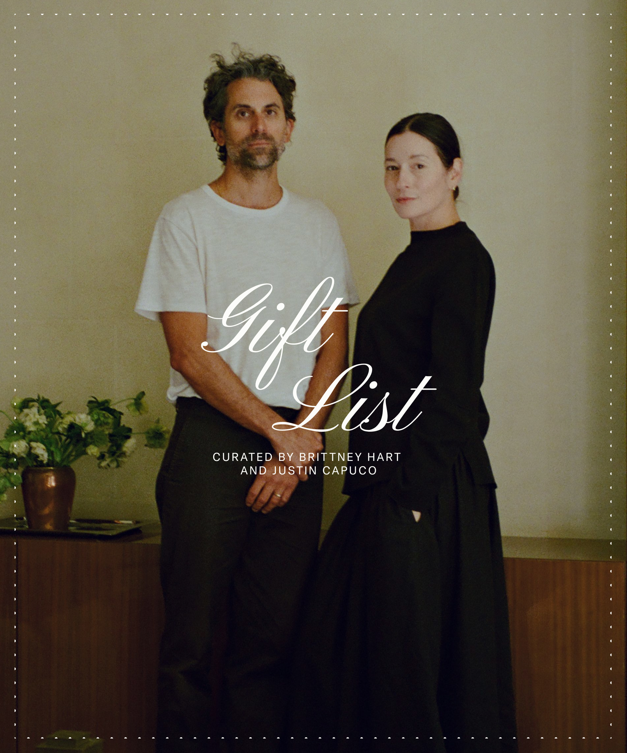 A man in a white t-shirt and a woman in a long black dress stand beside each other indoors. The words Gift List curated by Brittney Hart and Justin Capuco are overlaid in elegant white text.