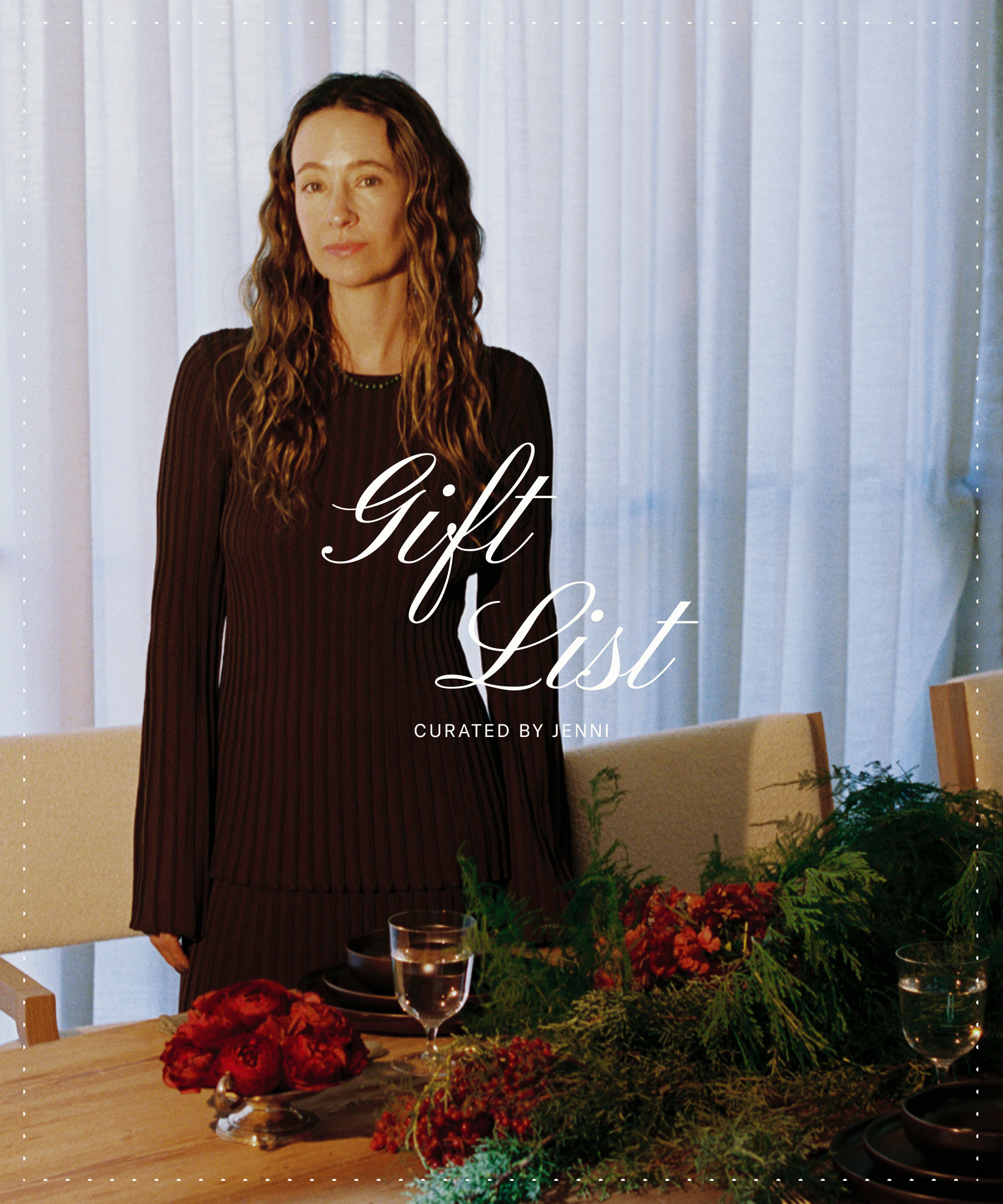 A woman with wavy brown hair in a dark pleated dress stands by a festive dining table with greenery and red flowers. The text “Gift List Curated by Jenni” is written over the image.